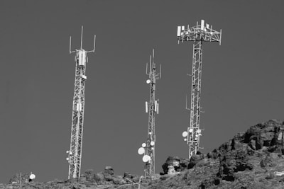 A black and white photo of cell towers