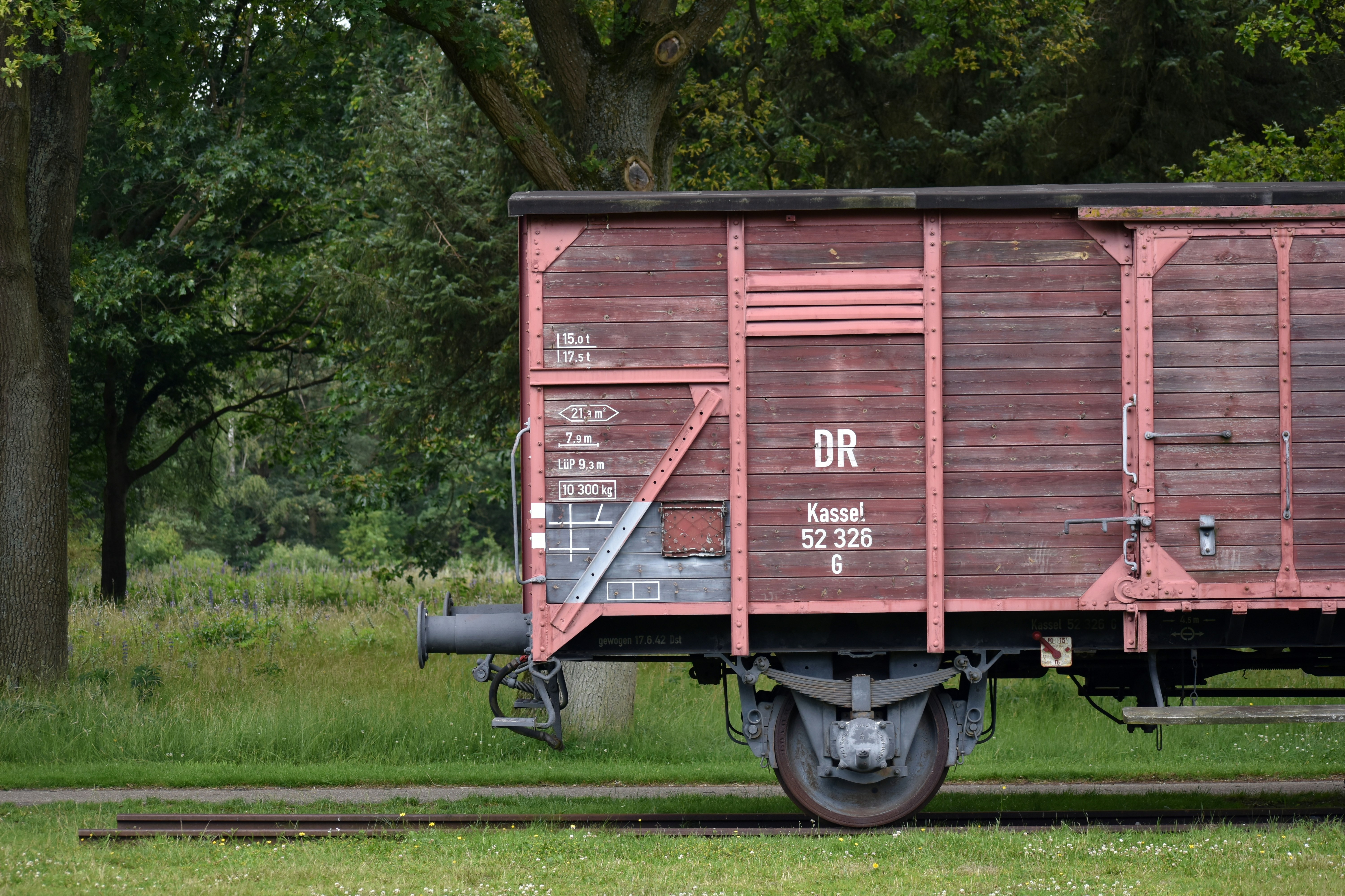 A red train car sitting on top of train tracks