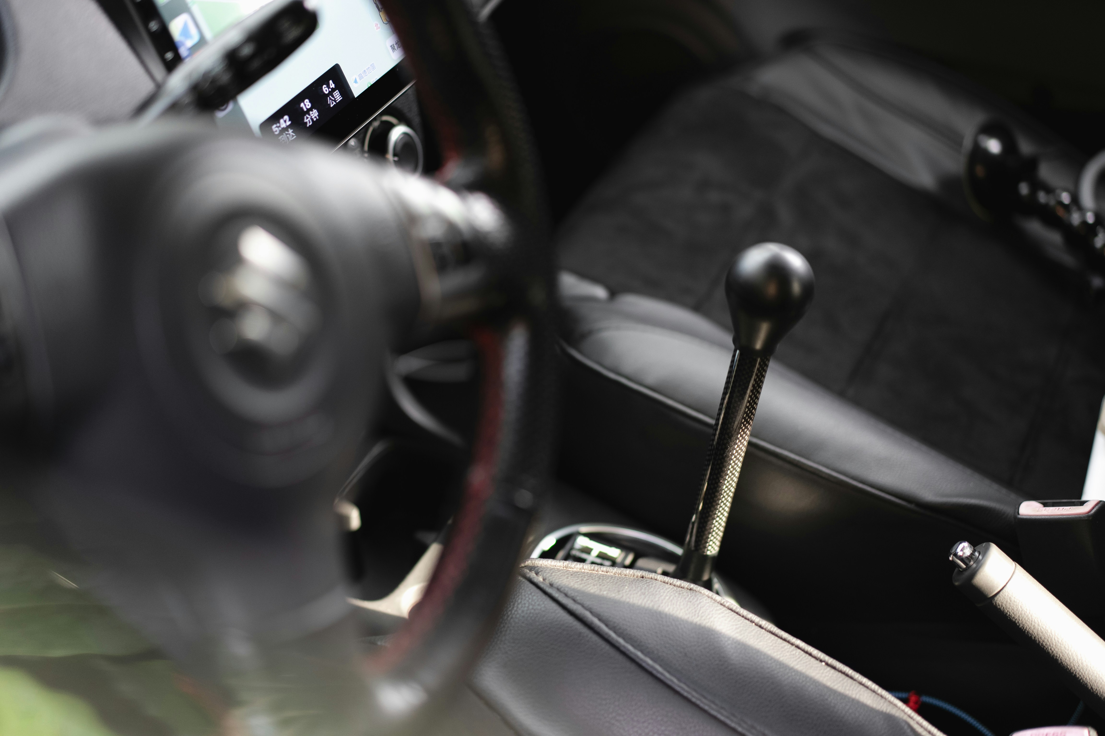 A steering wheel and dashboard of a car