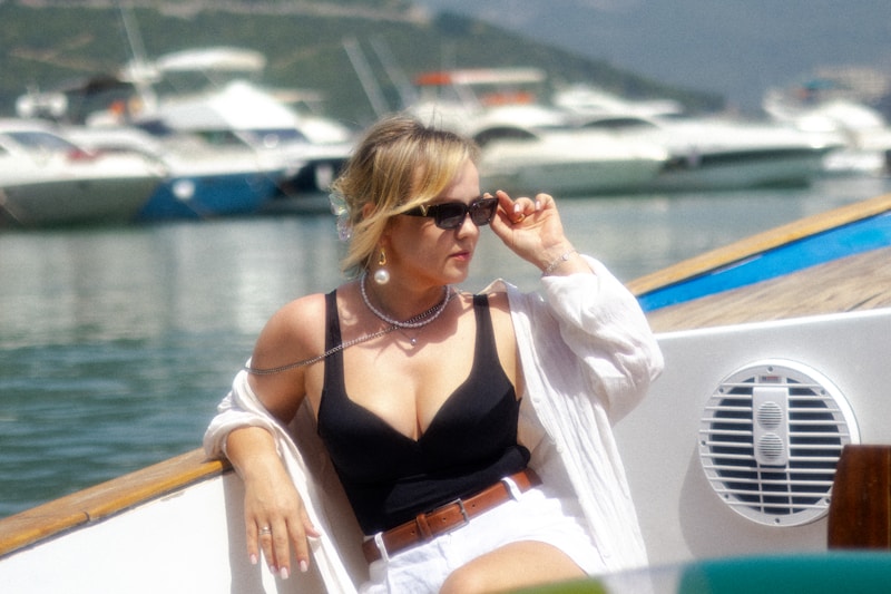 Elegant woman relaxing on yacht