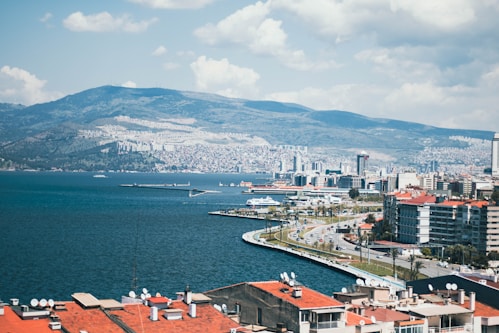 A large body of water with a city in the background