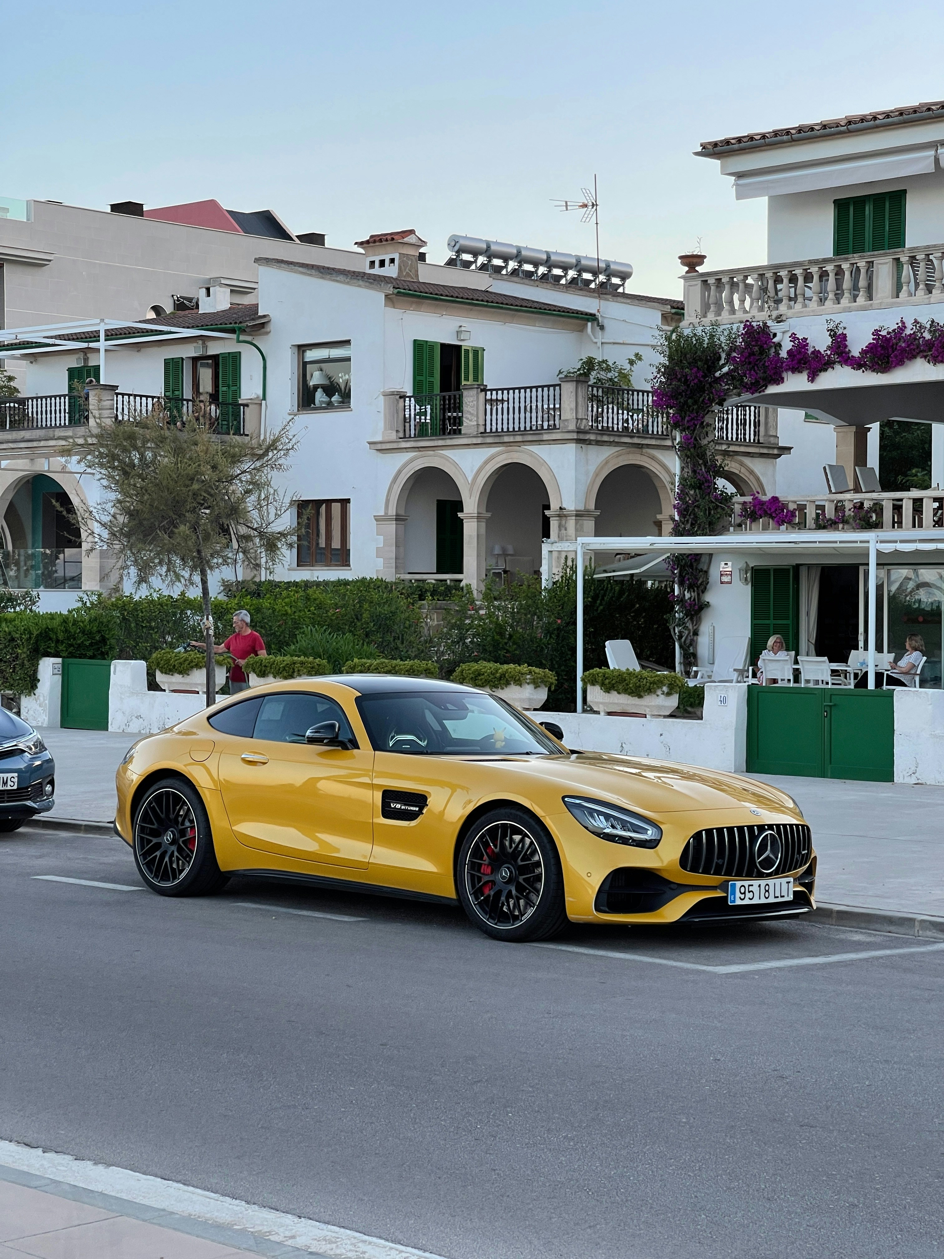 Two cars parked on the side of the road