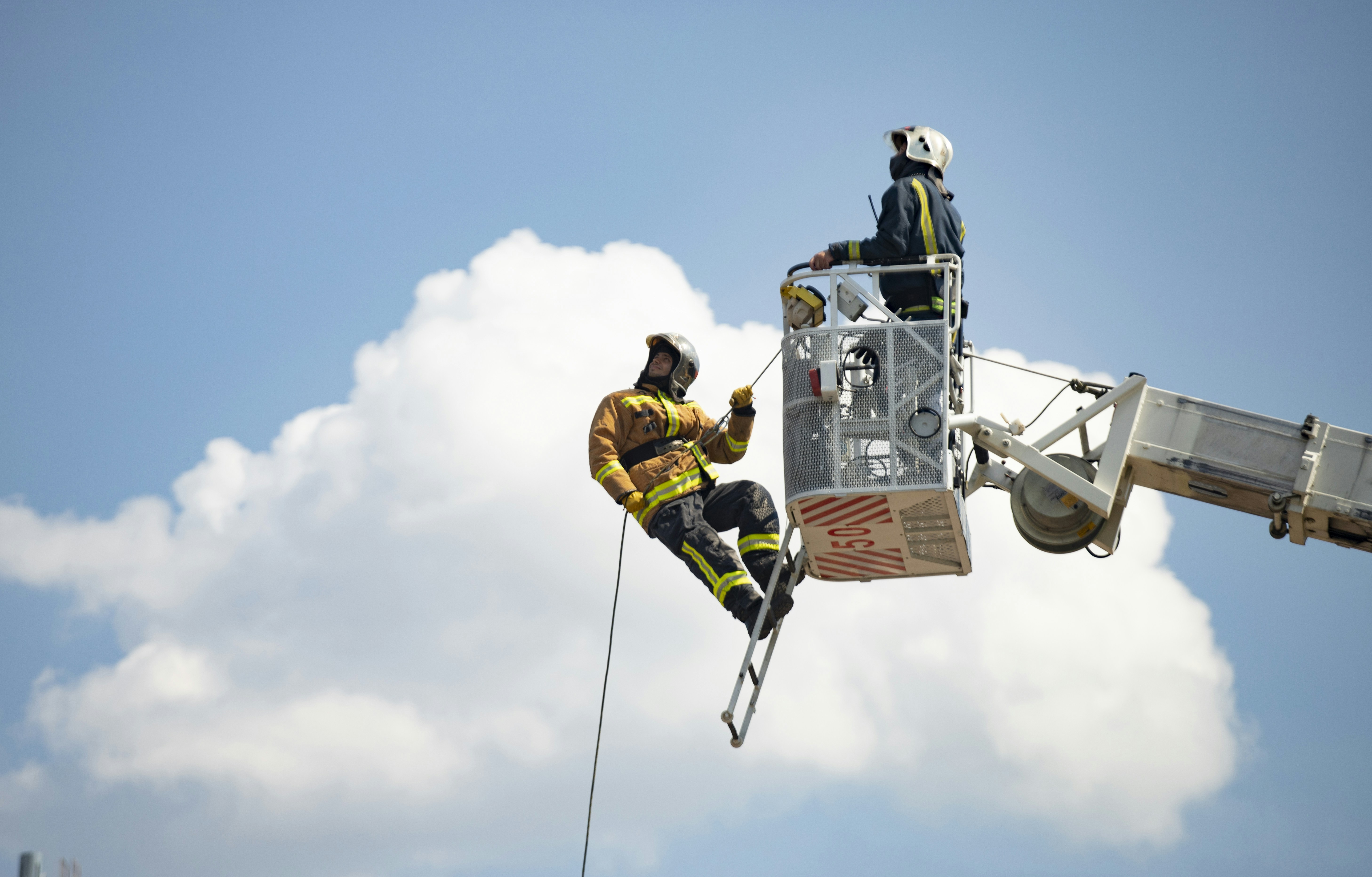 Close-up on a firefighter's helmet with a blurred background.