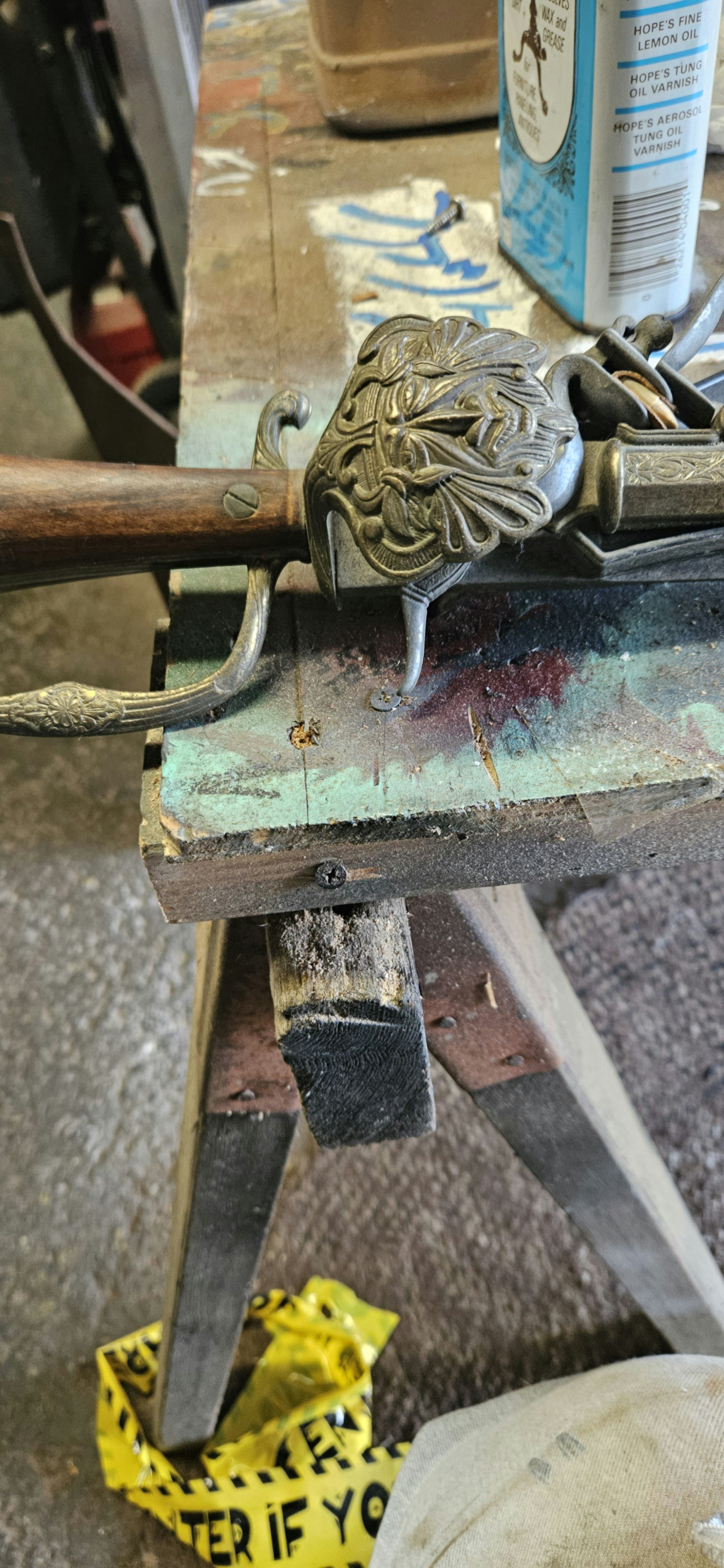 Close-up of firearm components and accessories on a workbench