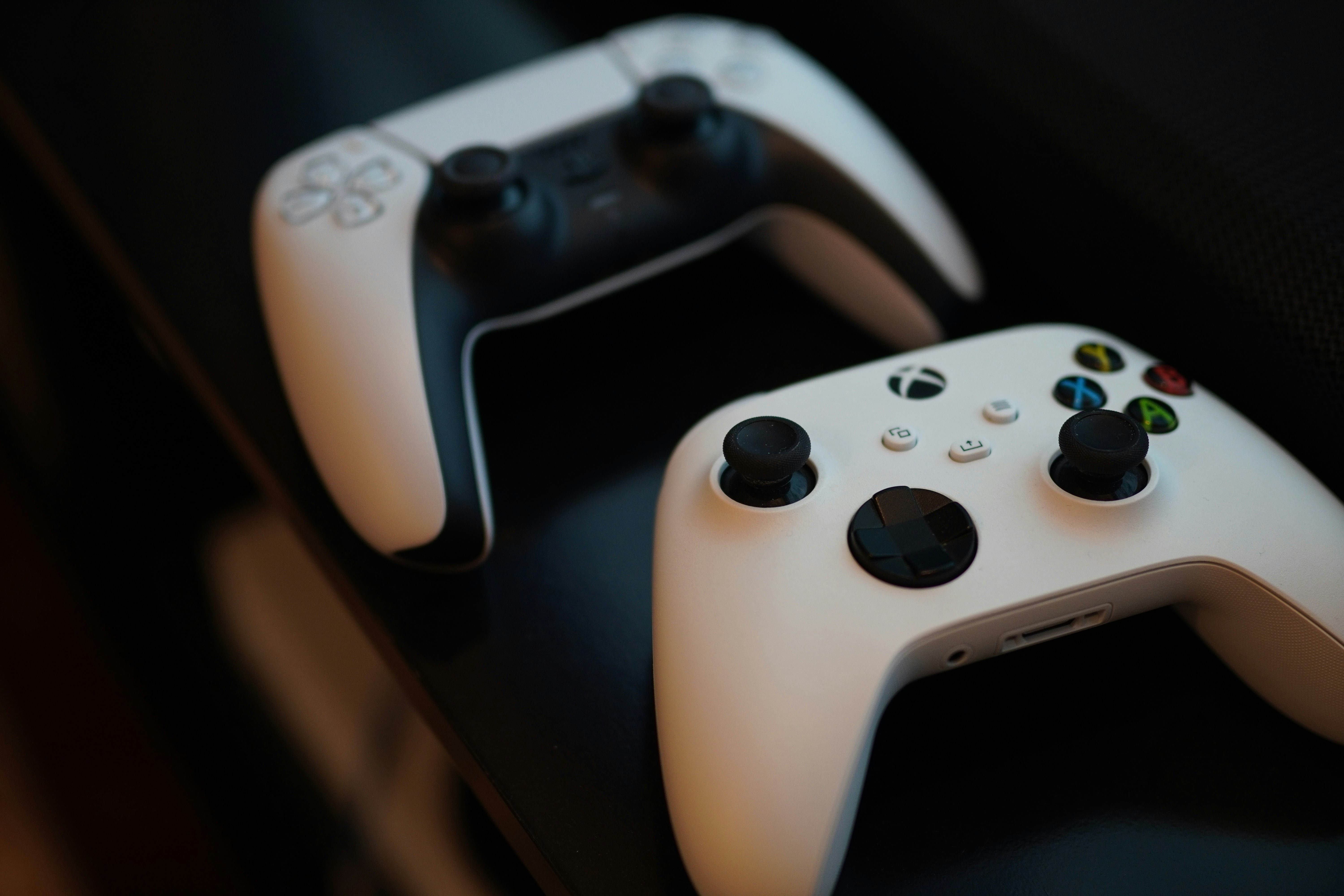 A close up of two video game controllers