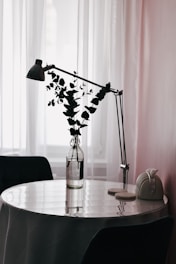 A table with a vase of flowers on it