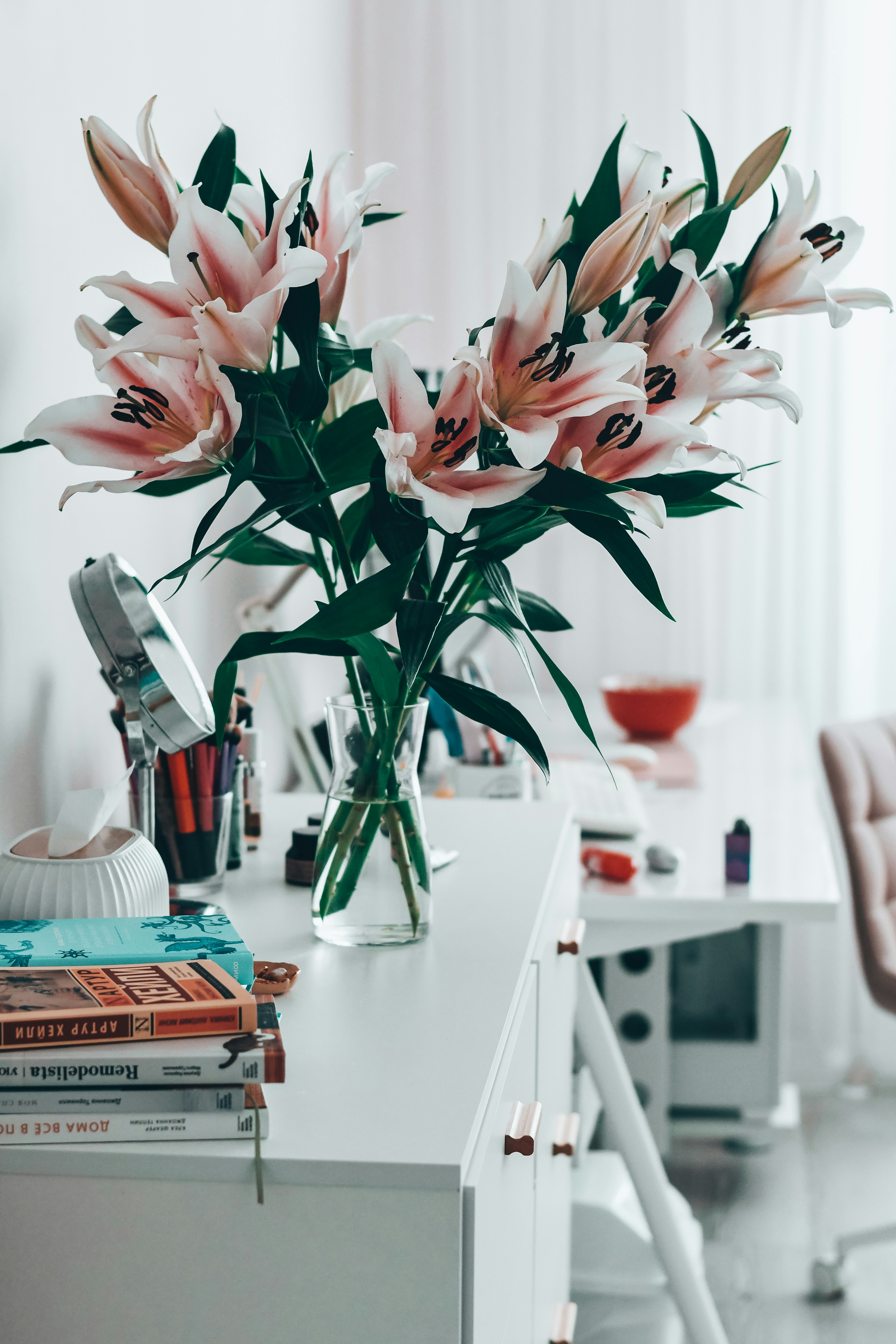 A vase filled with flowers sitting on top of a white table