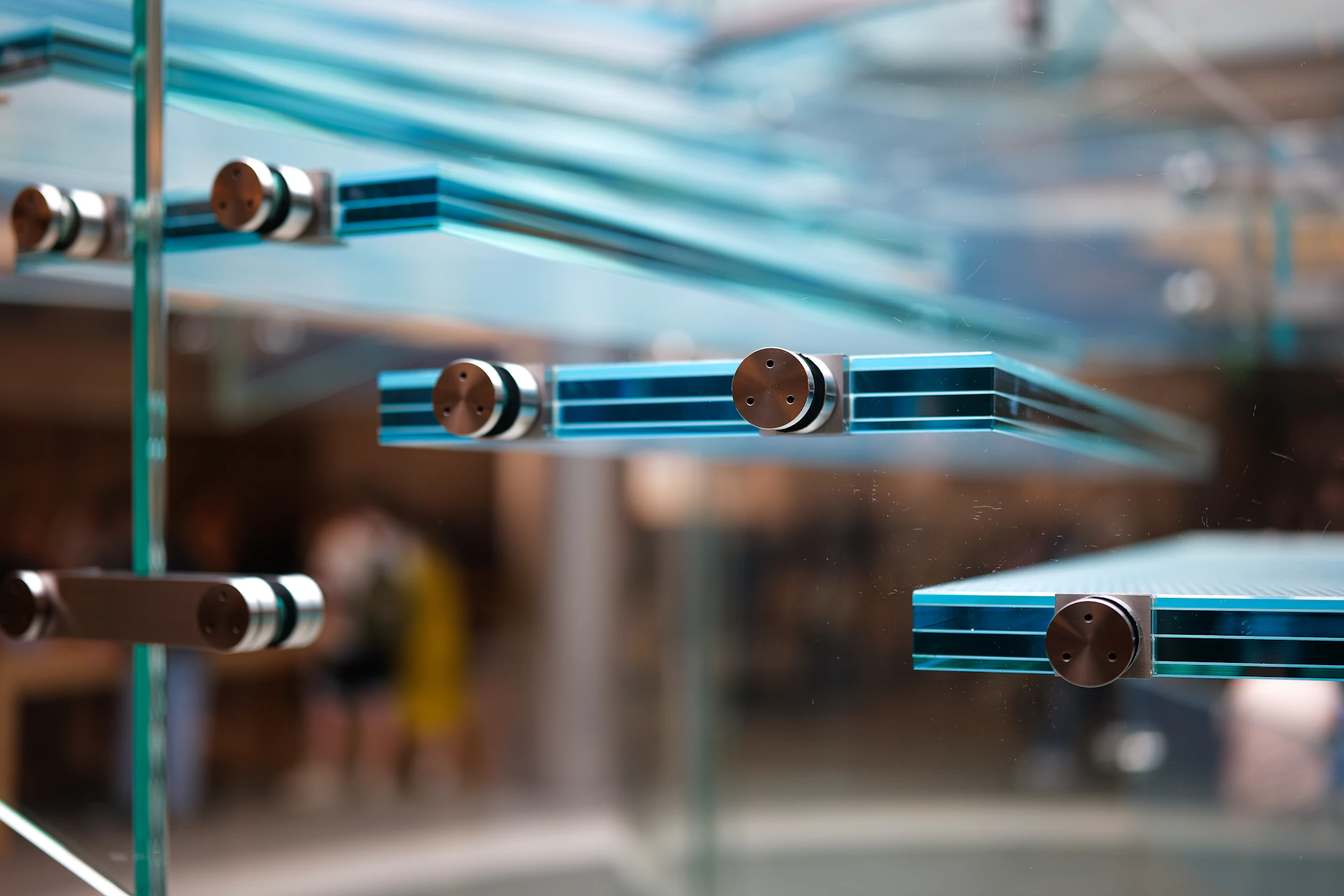 A close up of a glass window with metal bars
