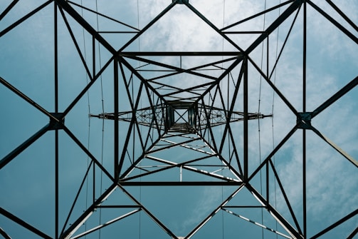 A high voltage power line with a blue sky in the background