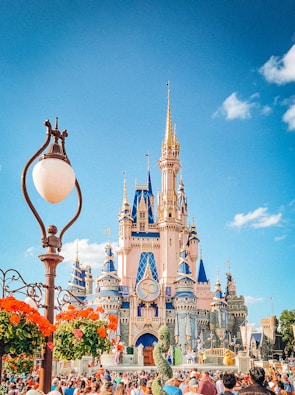 A group of people standing in front of a castle