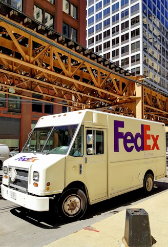 A fedex truck parked on the side of the road