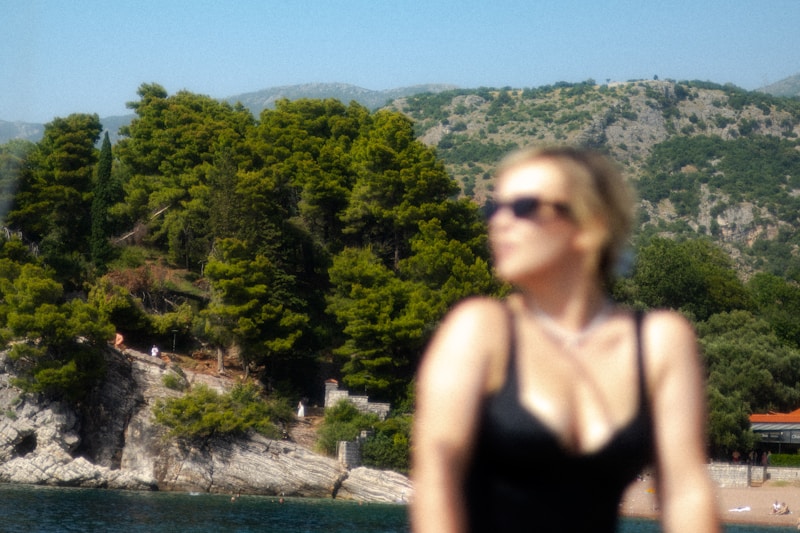 Gorgeous Greek woman in black swimsuit