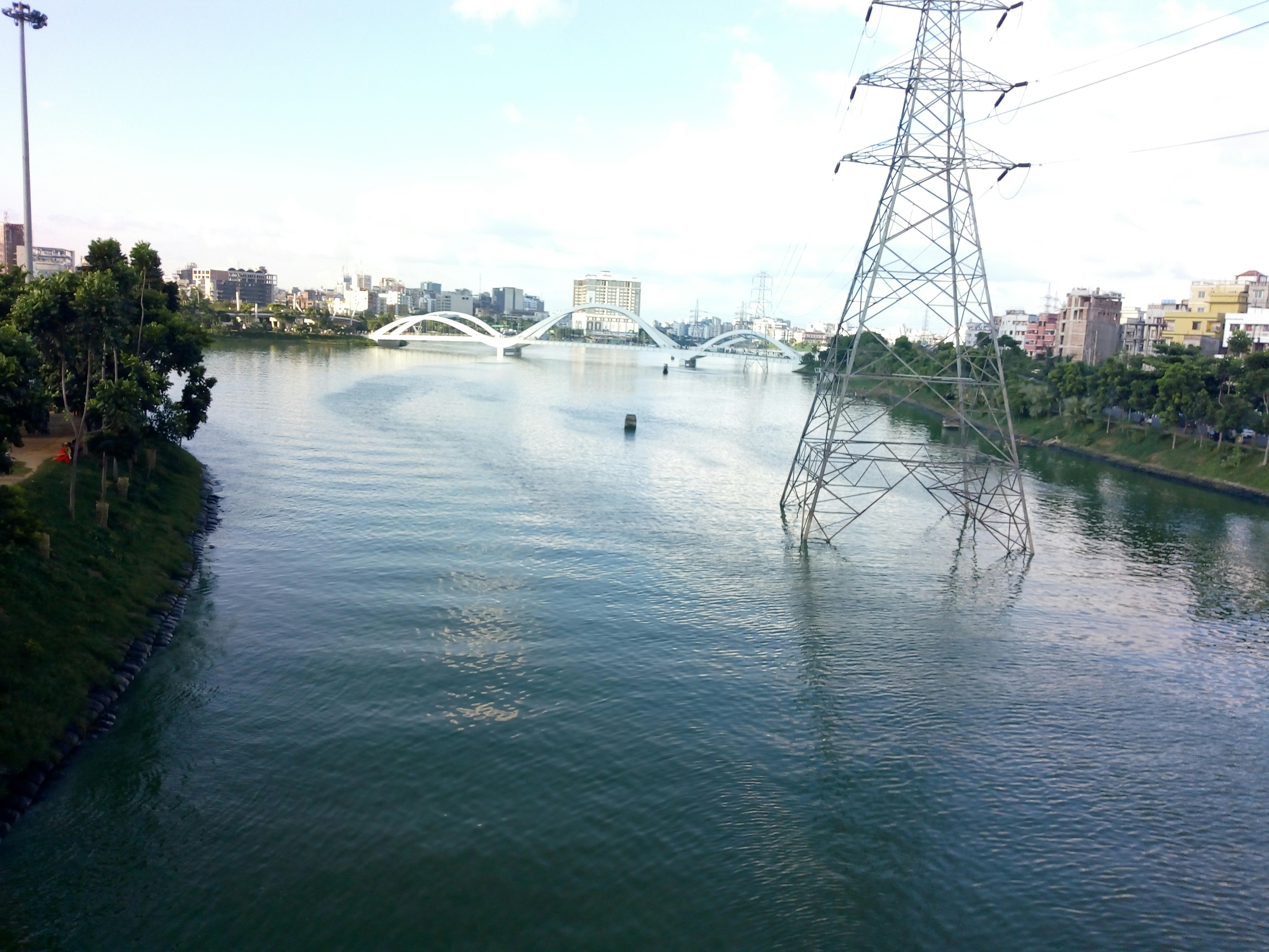 A large body of water with power lines above it