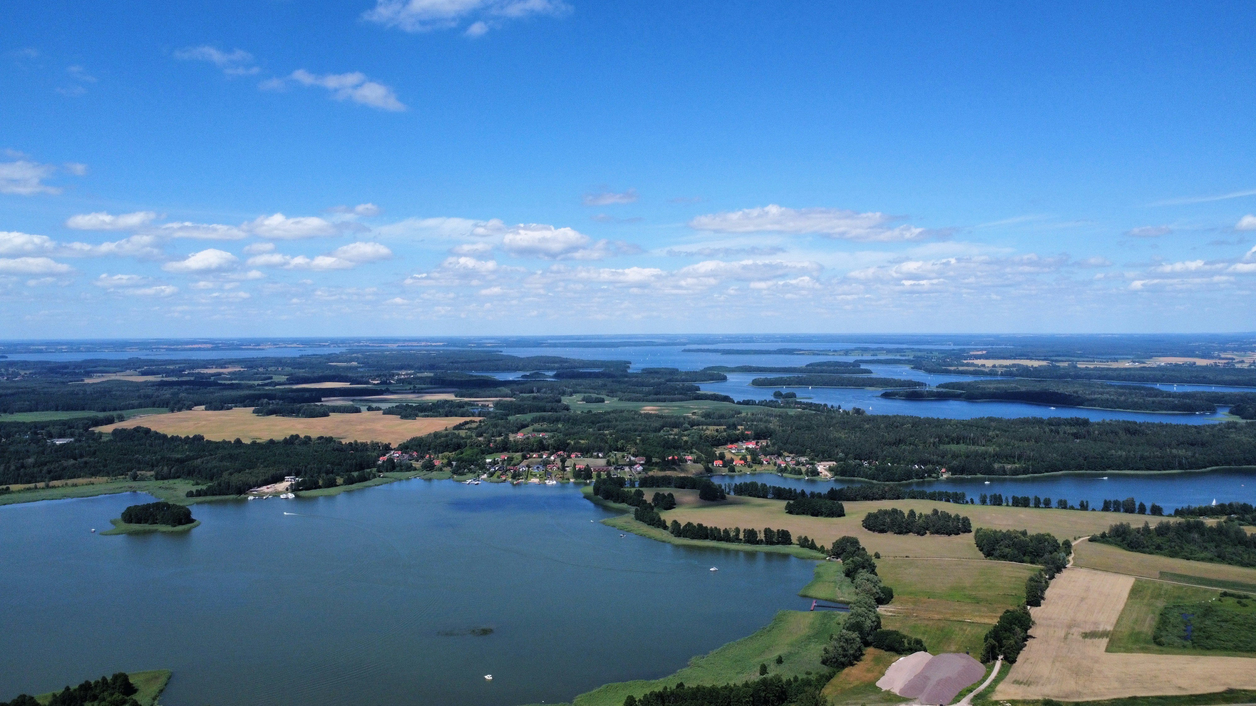An aerial view of a lake surrounded by land