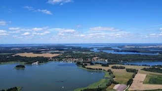 An aerial view of a lake surrounded by land