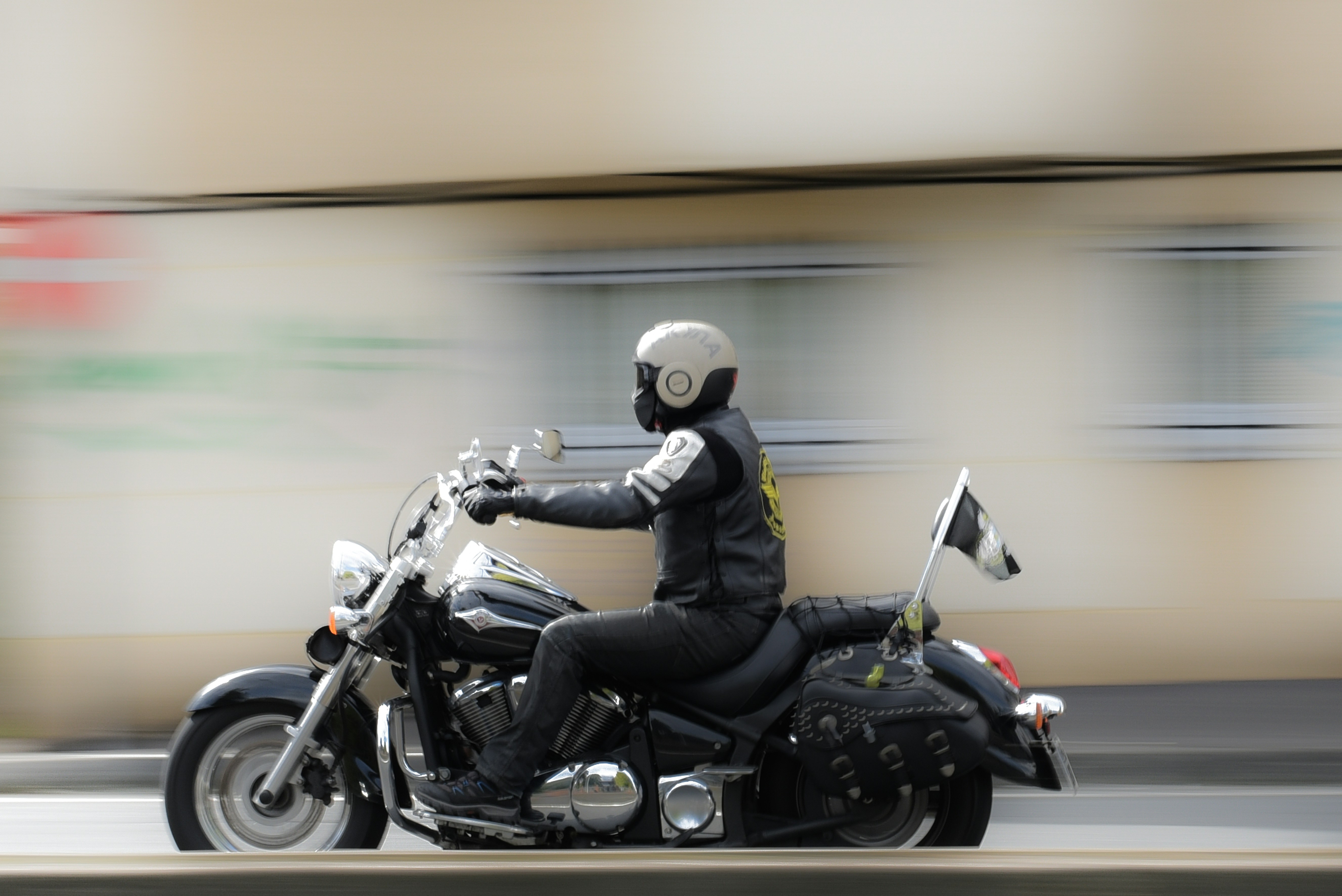 A person riding a motorcycle on a city street