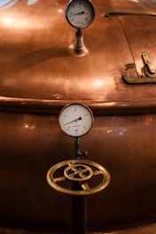A large metal tank with a clock on top of it