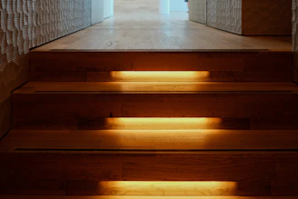 A light shines on a set of stairs