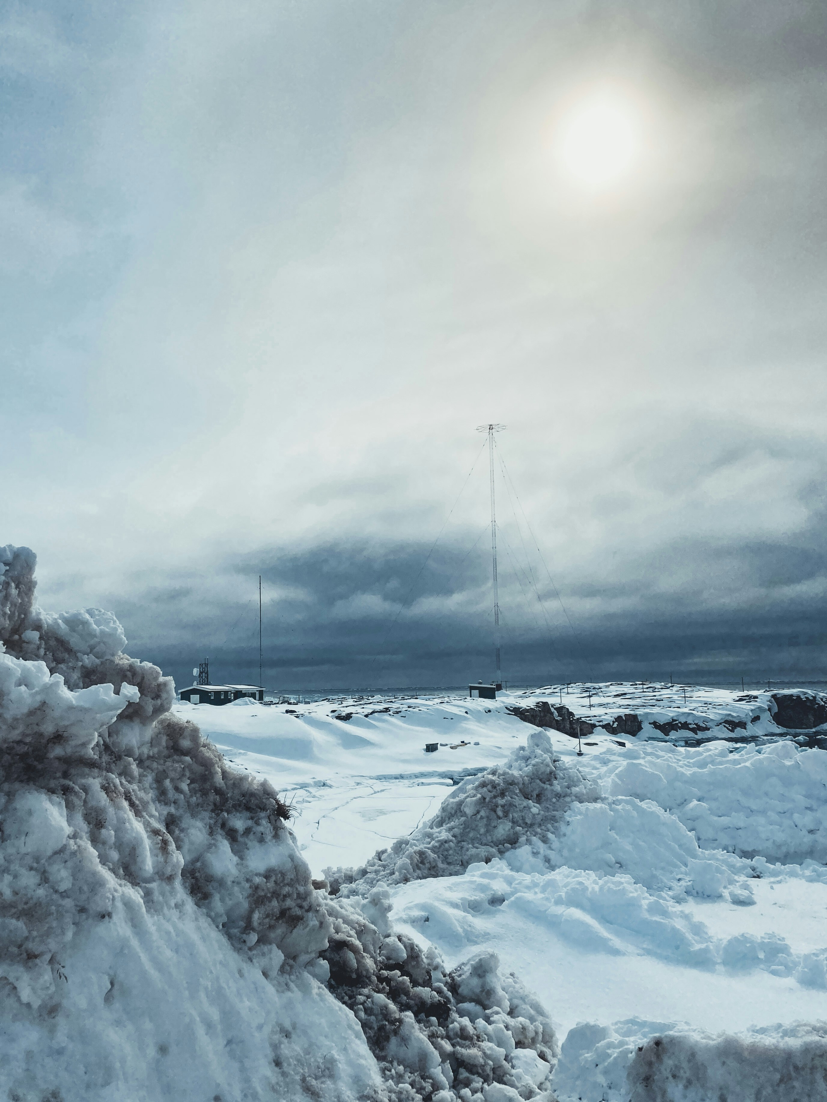 A large pile of snow sitting on the side of a road