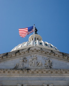 An american flag flying on top of a building