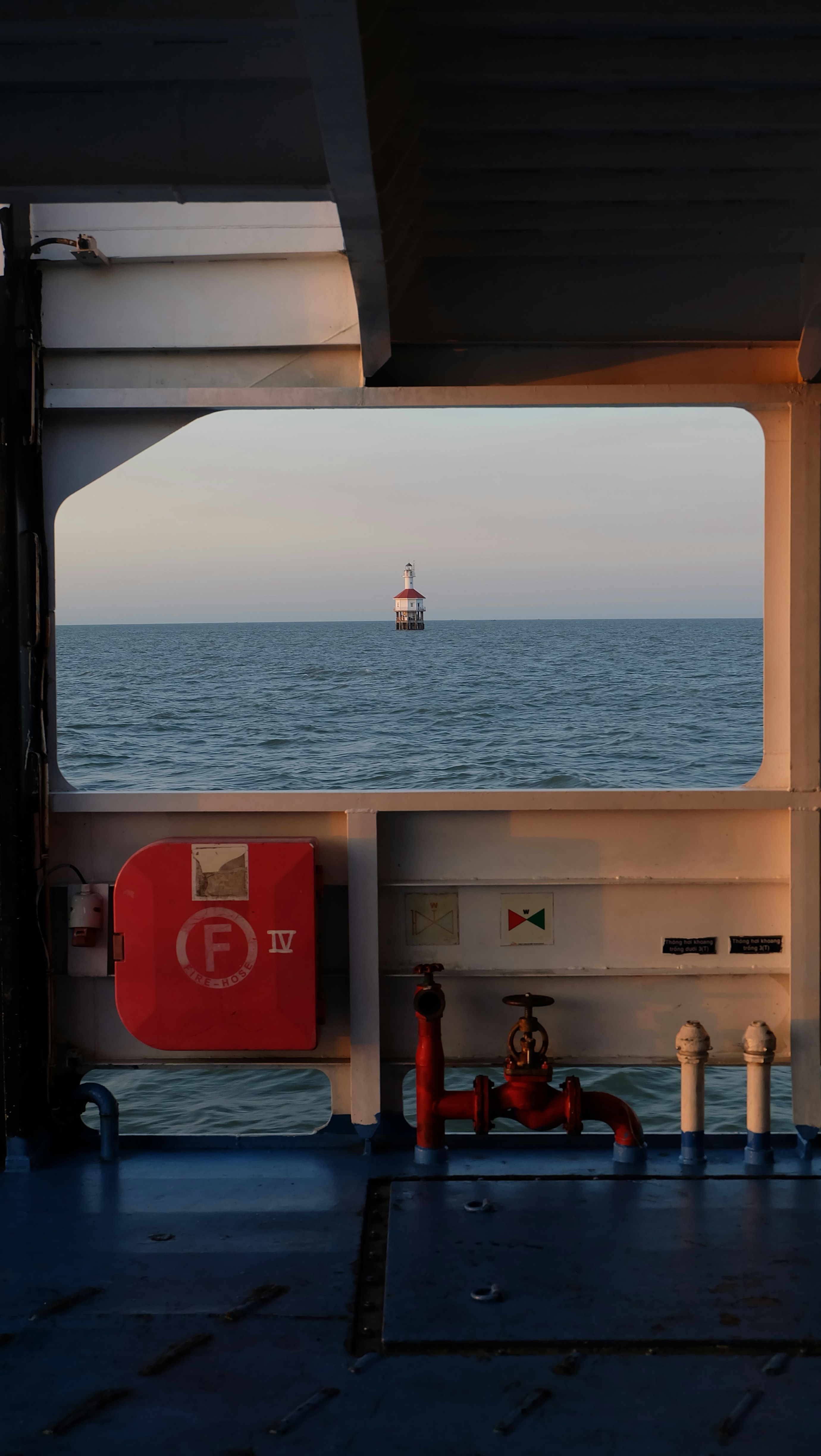 A view of the ocean from inside a boat