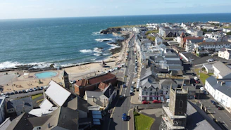 An aerial view of a town by the ocean