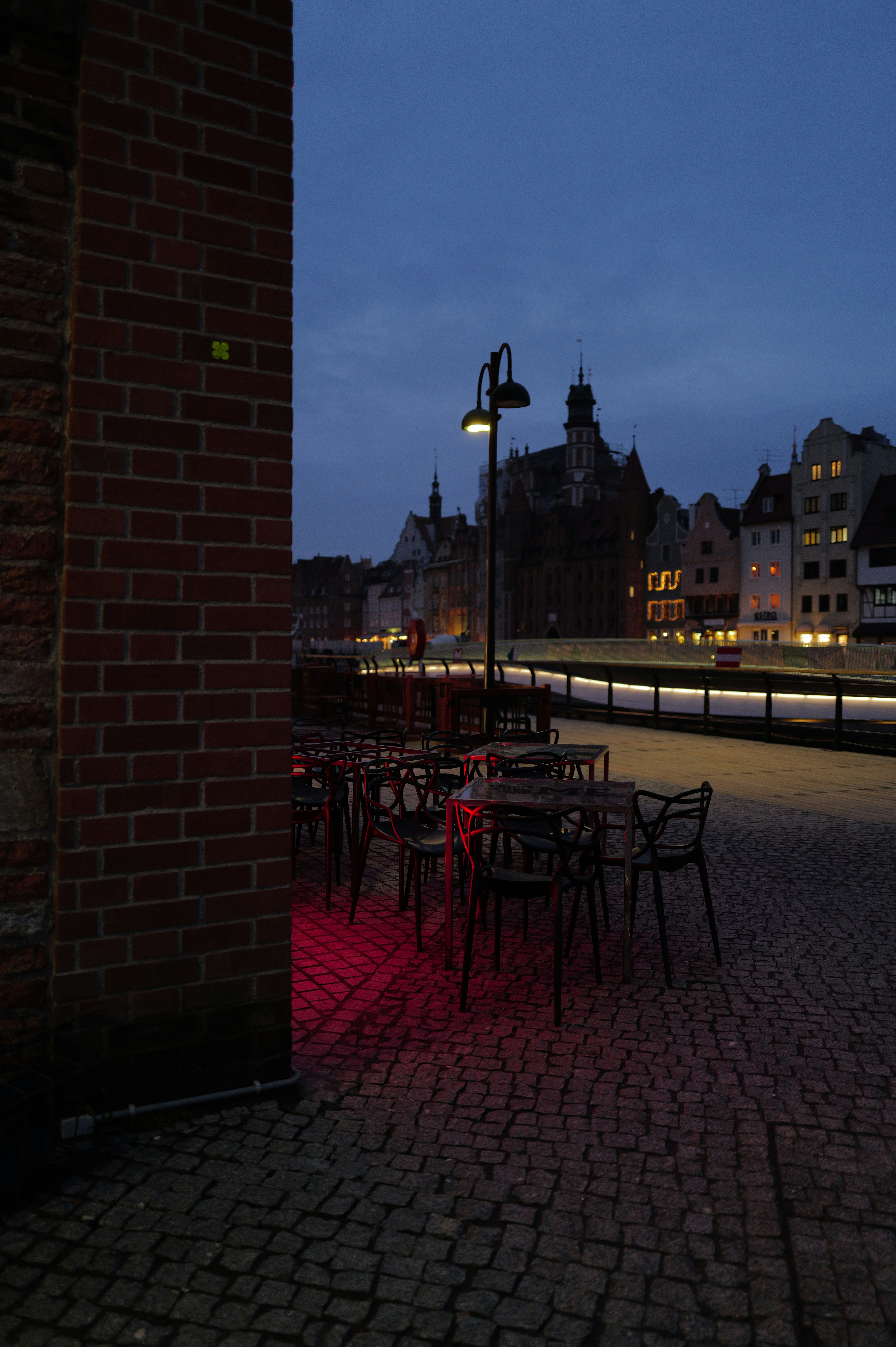 A table and chairs are lit up at night