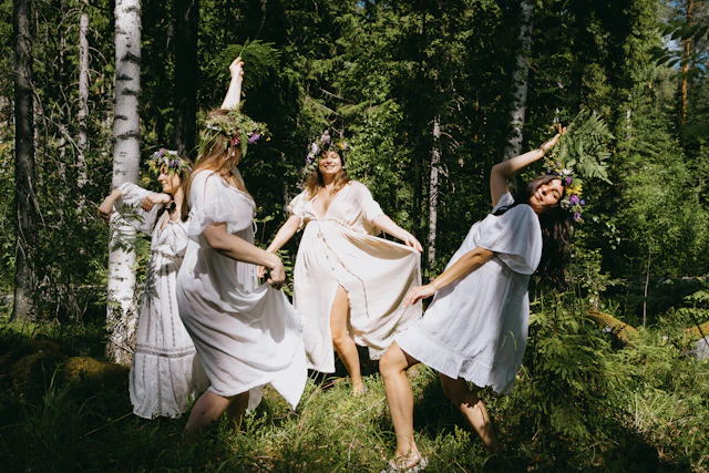 what is a tantra jam, four women in white dresses dancing in a sunlit forest