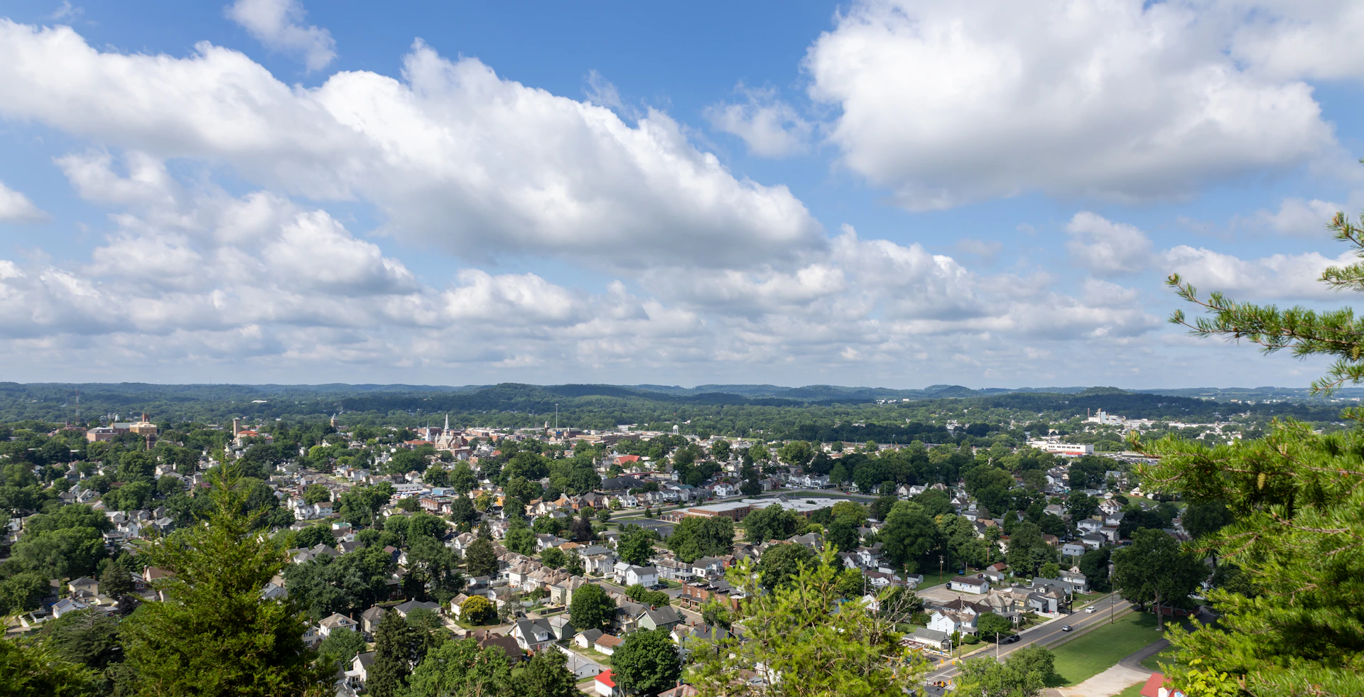 A view of a city from the top of a hill