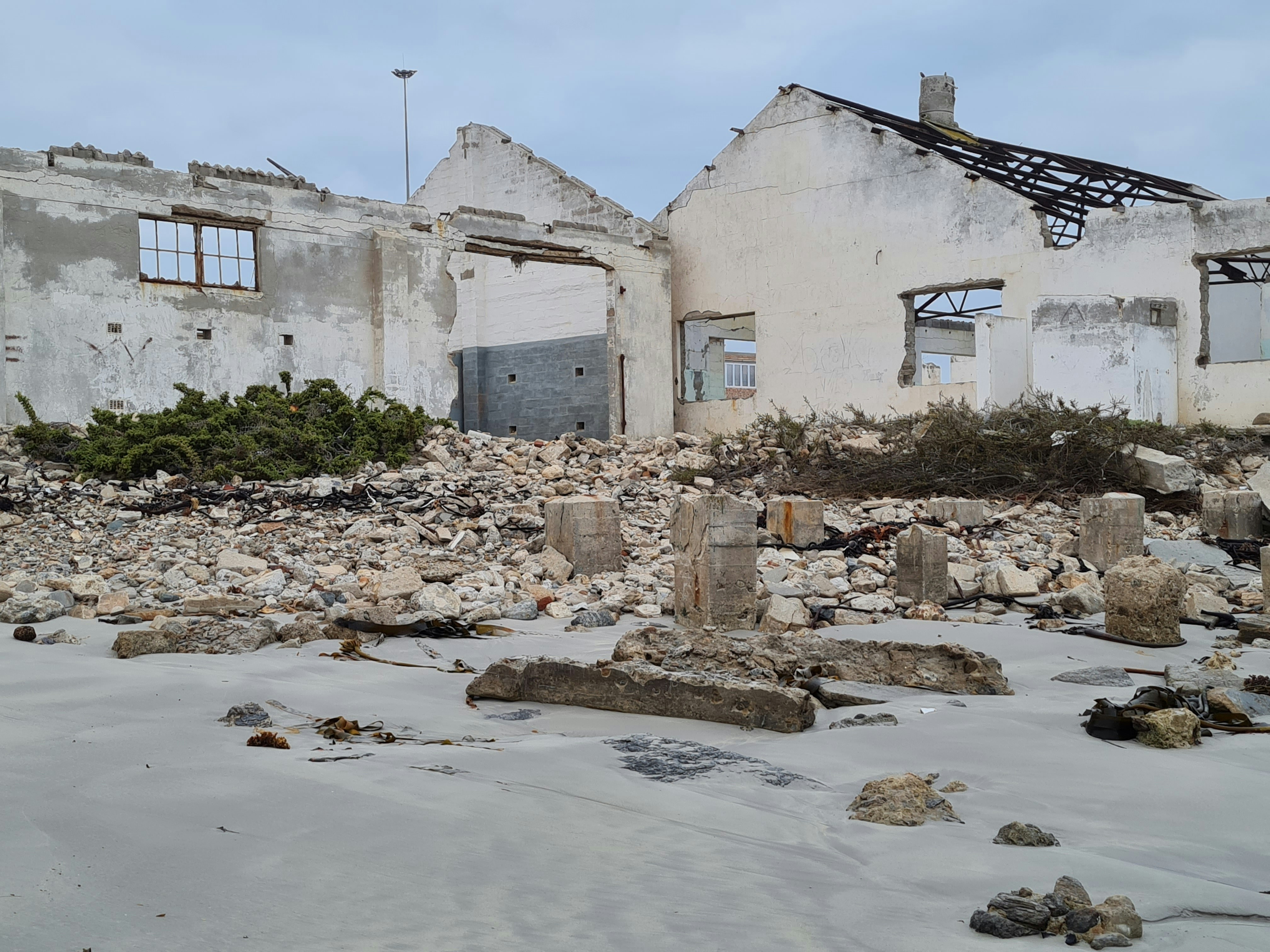 A bunch of buildings that are in the dirt