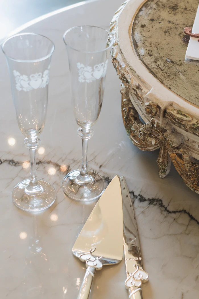 Close-up of a fine-dining wedding table with crystal and silverware