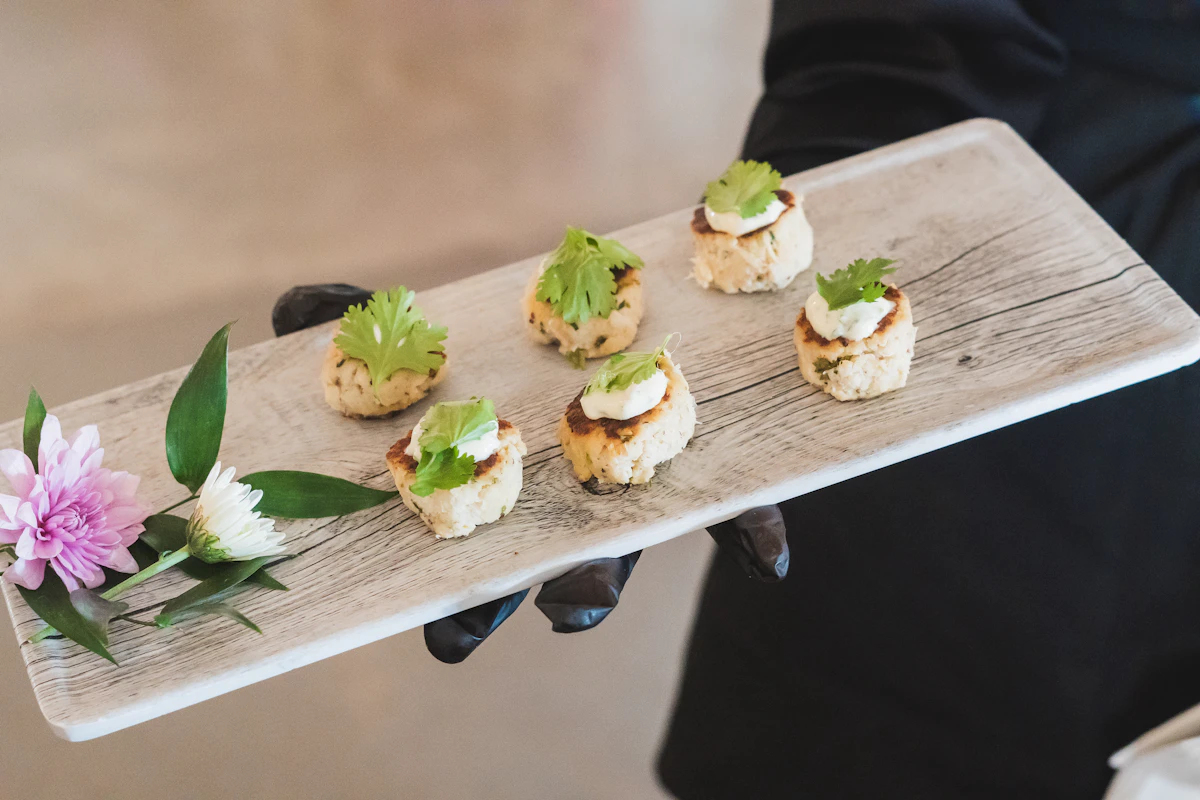 A catering spread of plated food set up at an event