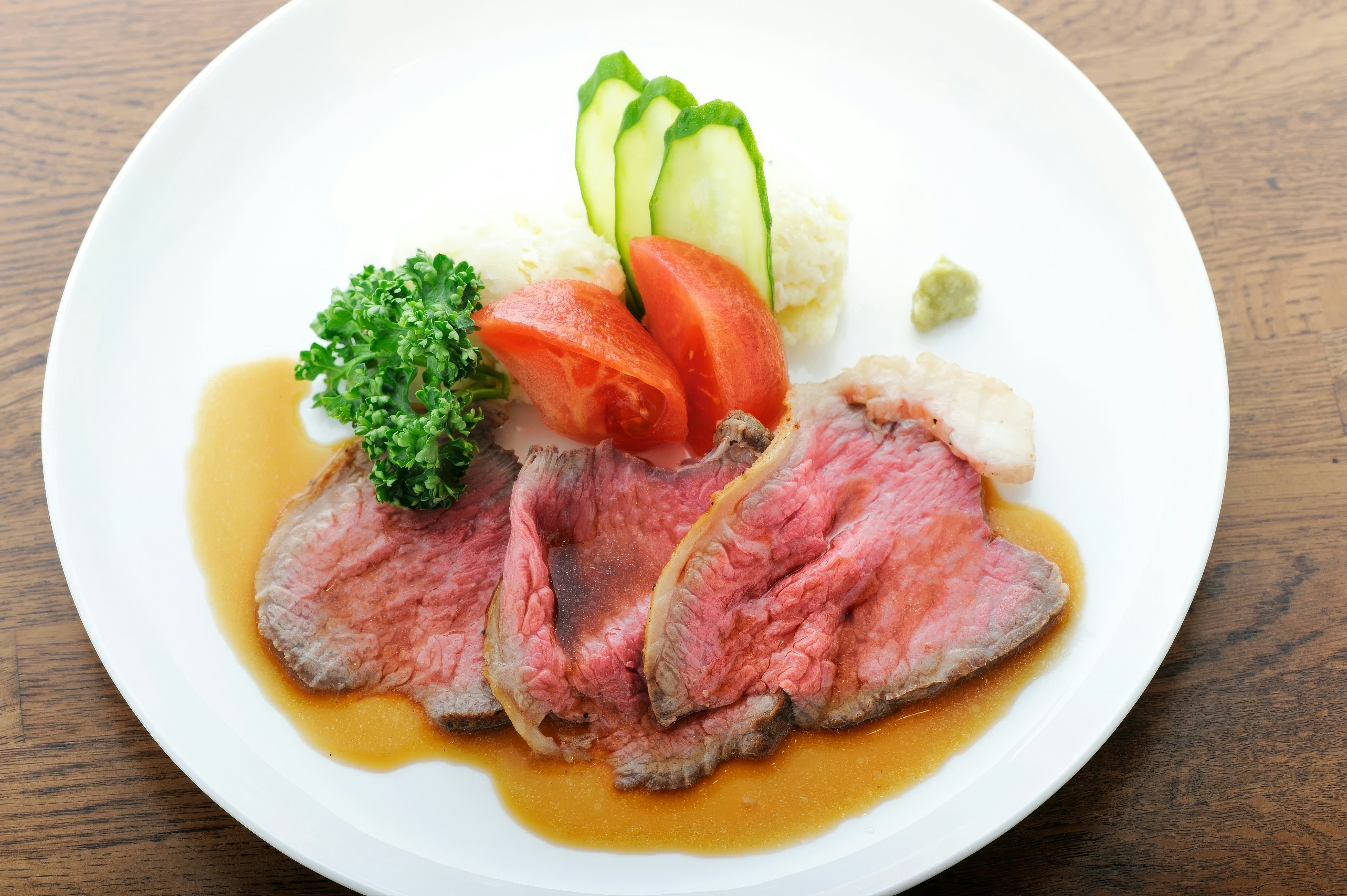 Wagyu beef steak plated with seasonal vegetables
