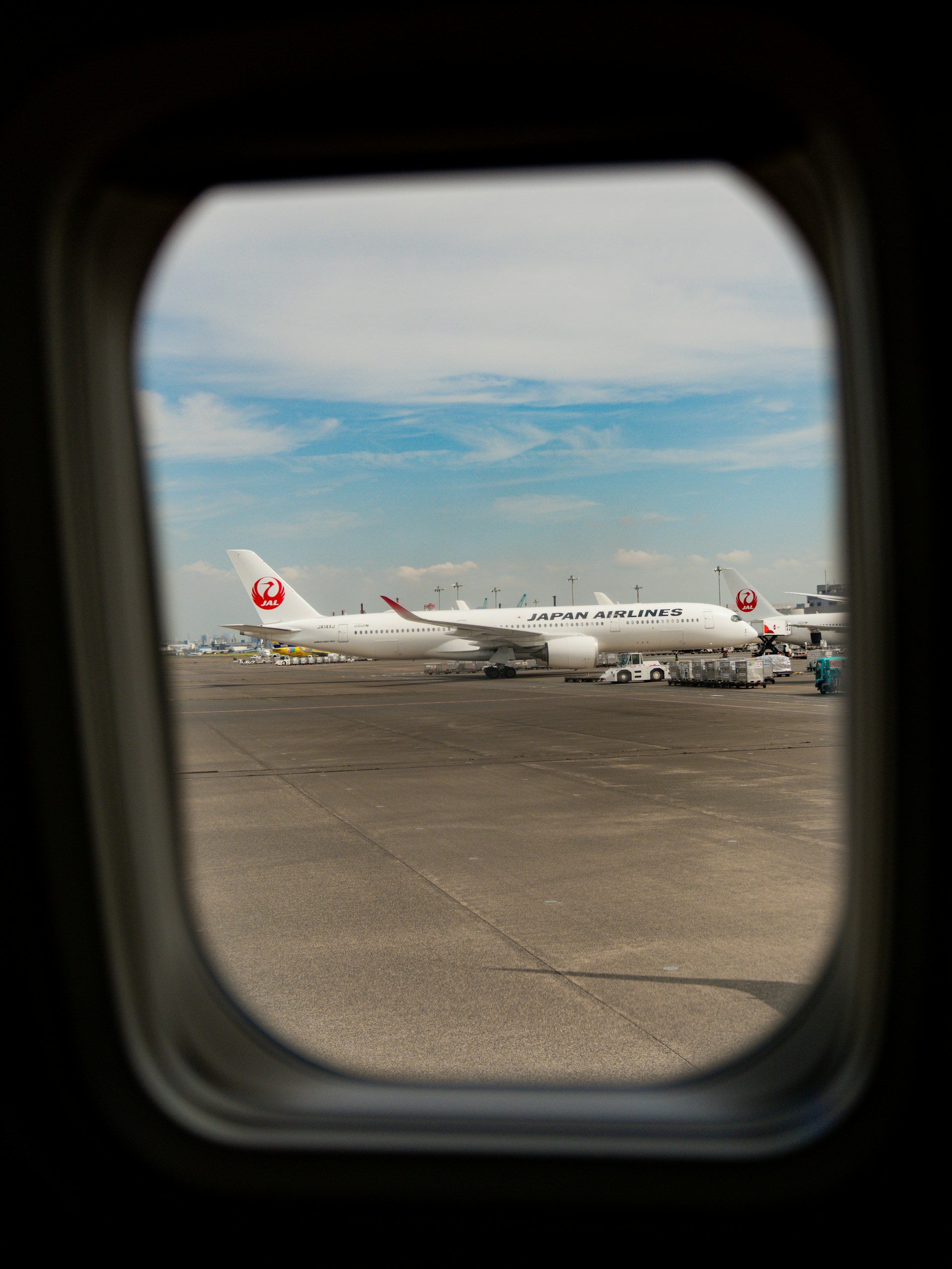 A view of a plane from inside an airplane window