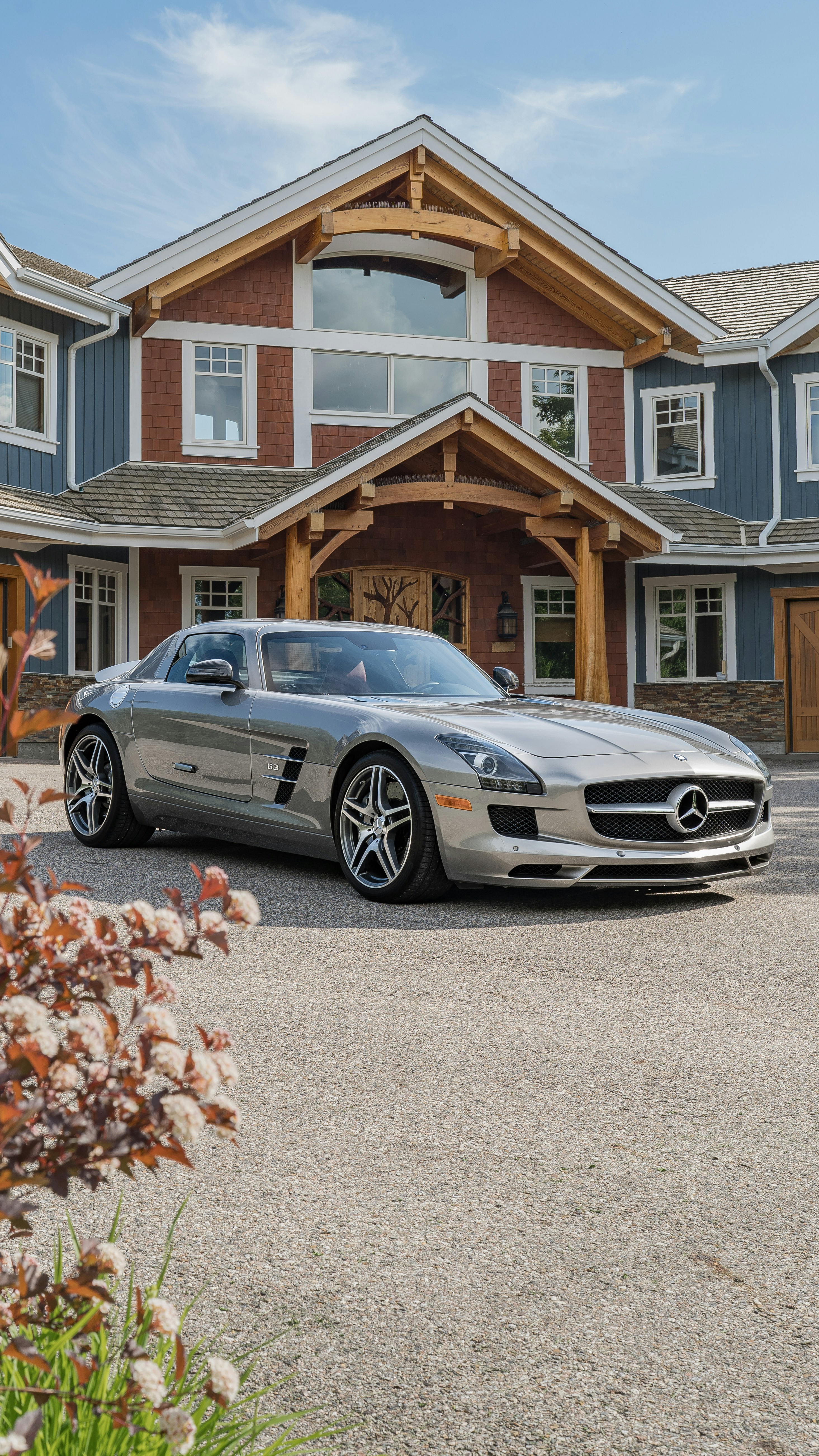 A mercedes sls parked in front of a large house photo – Free Wallpaper  Image on Unsplash, image size:3000x5333