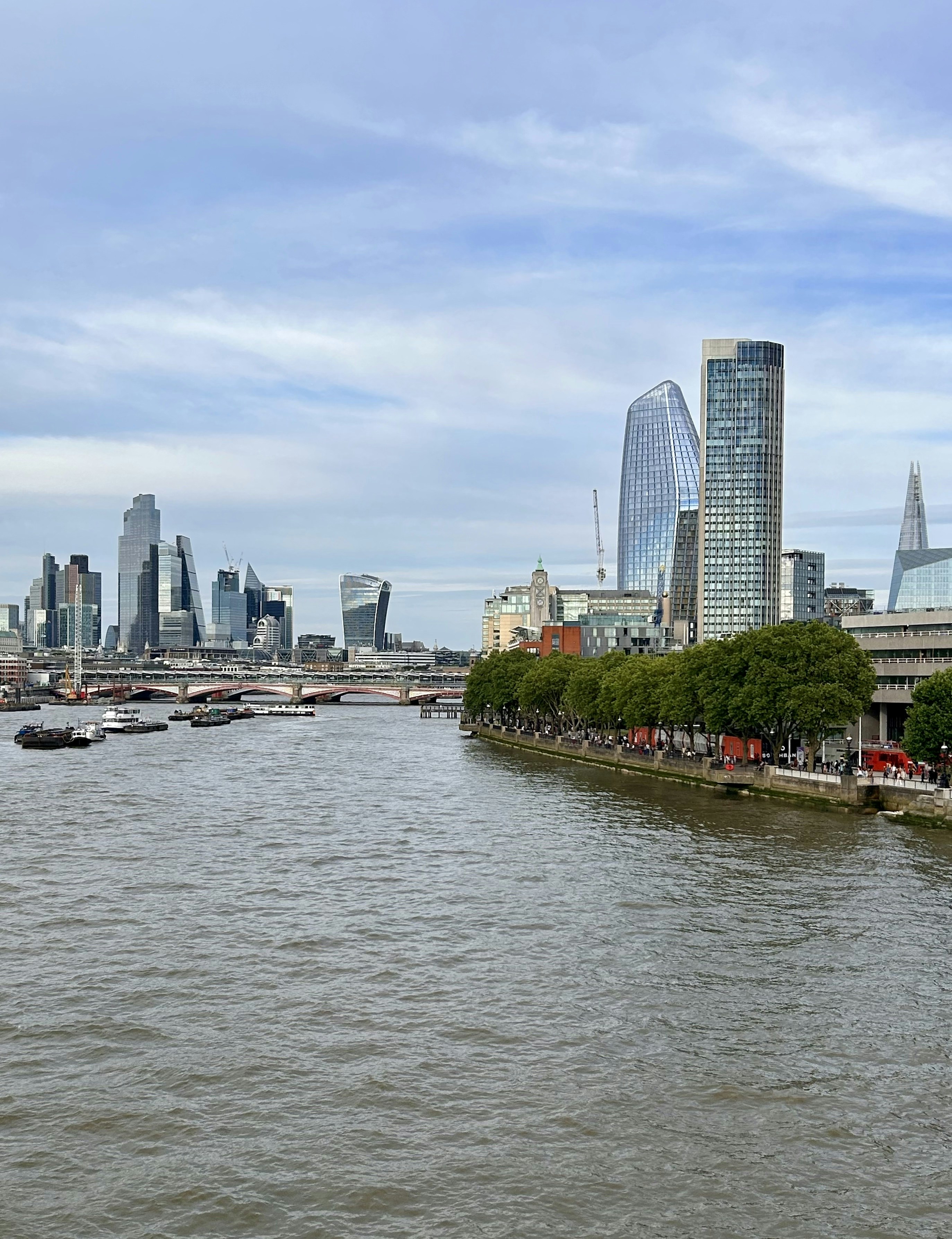 A view of a river with a city in the background