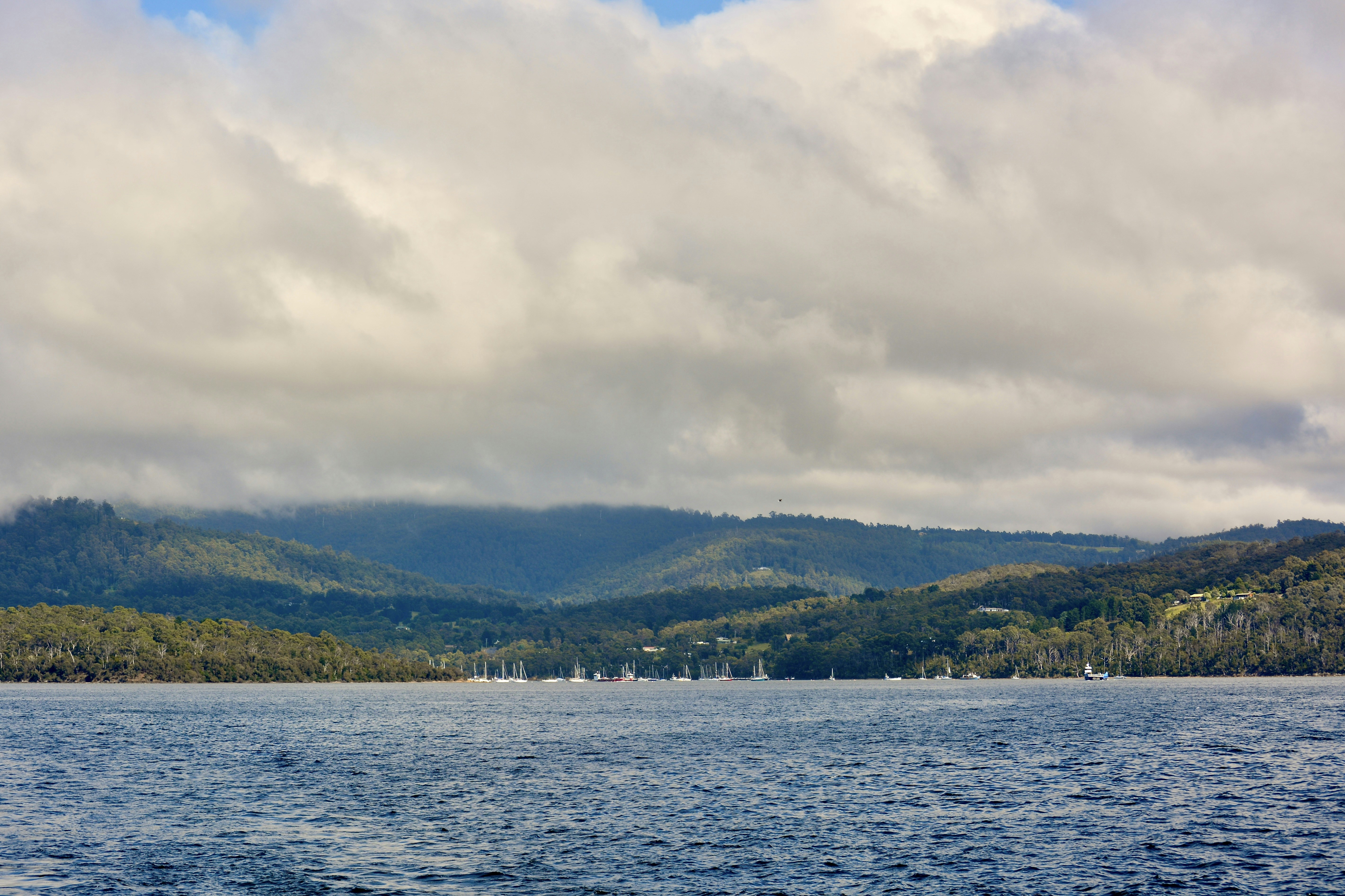 A large body of water with mountains in the background