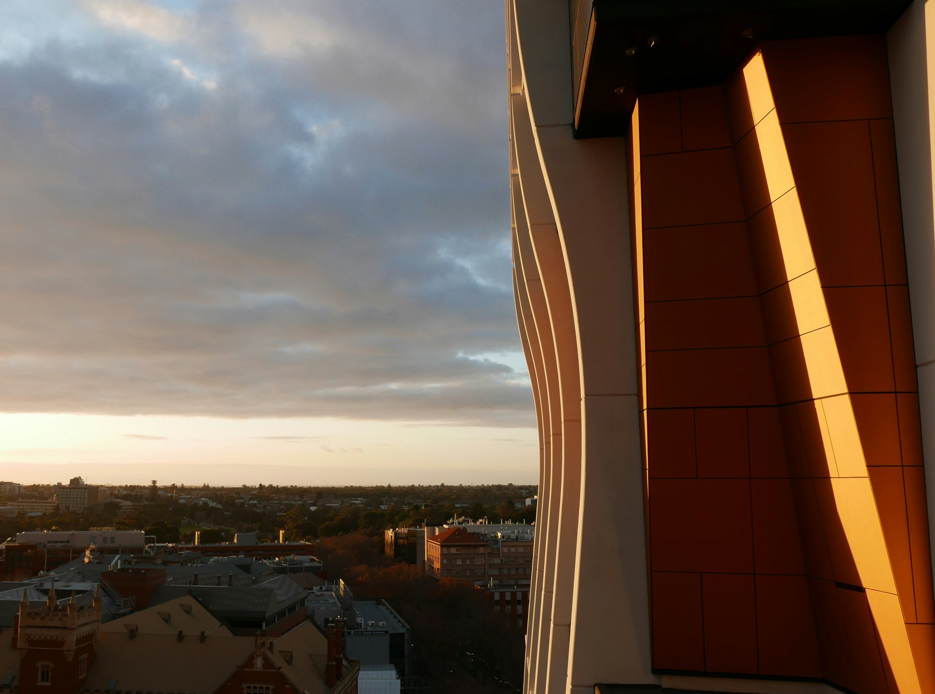 A view of a city from the top of a building