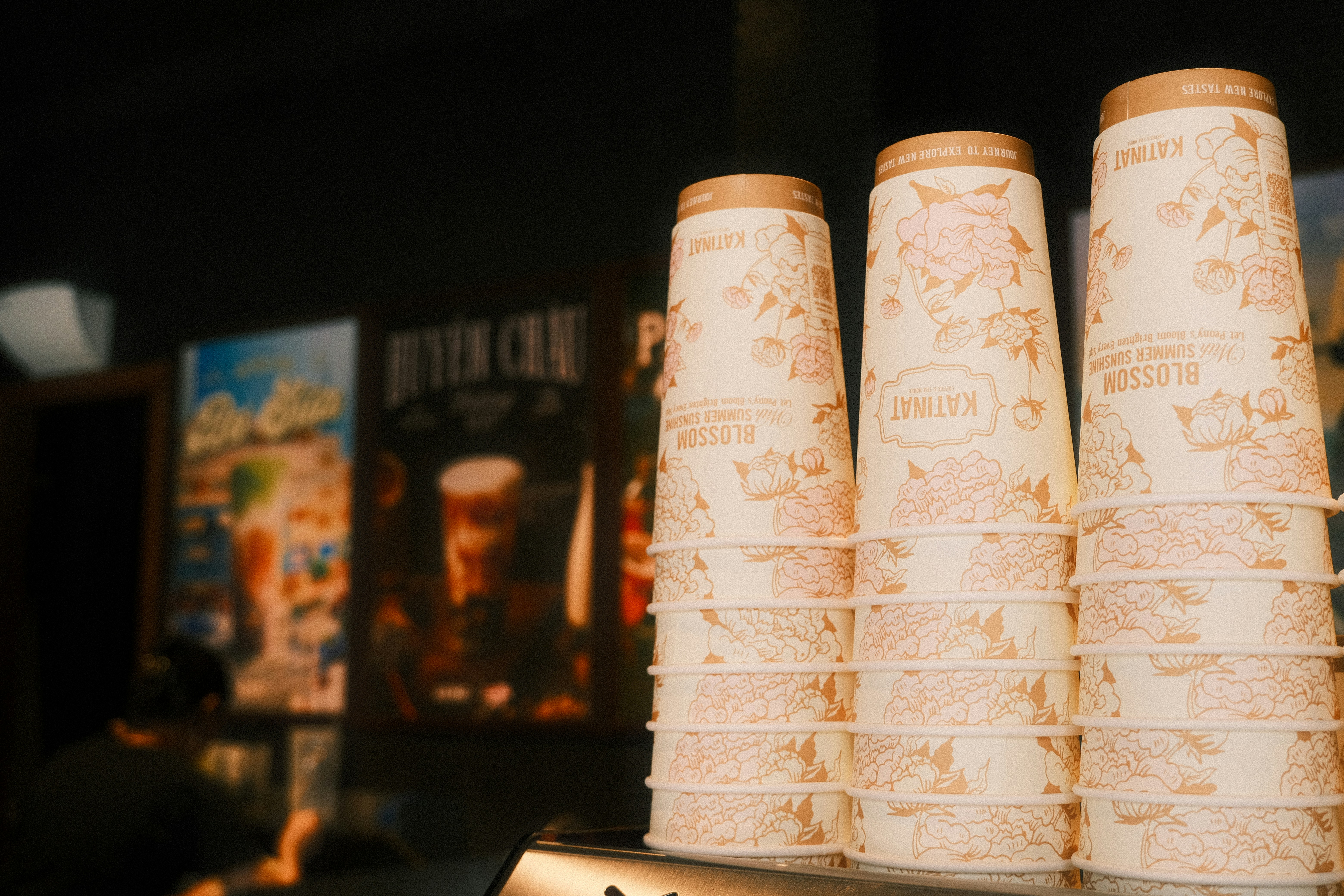 A row of beer bottles sitting on top of a counter