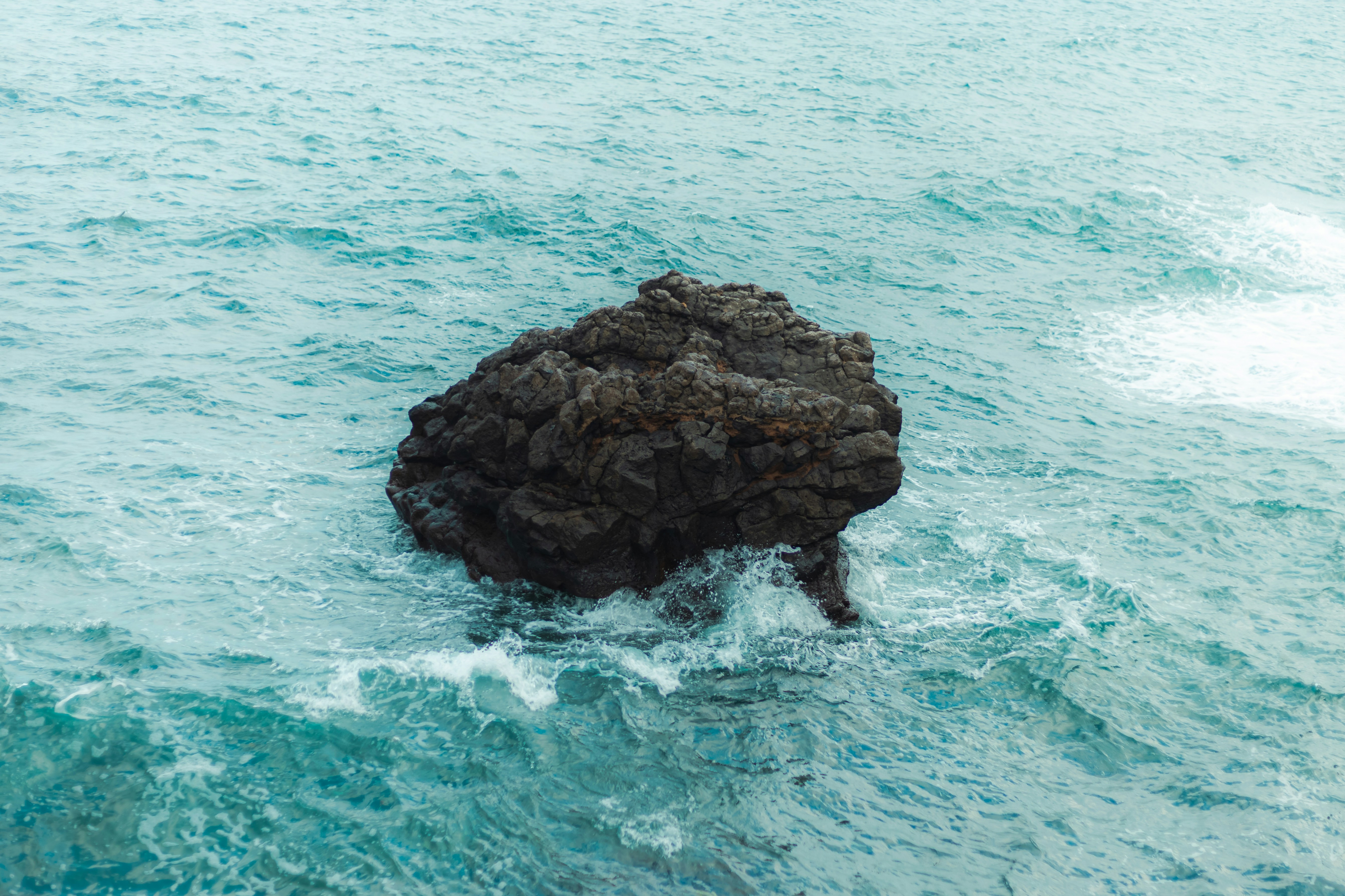 A rock in the middle of the ocean