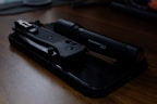 A knife and a knife sharpener on a table