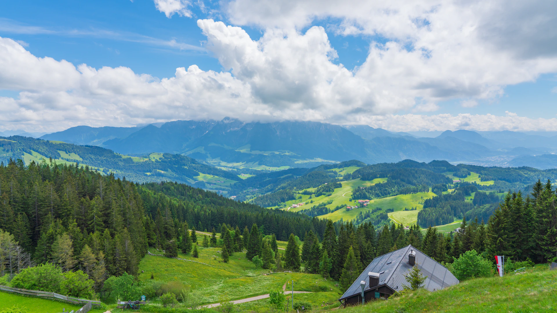 A grassy field with a tent in the middle of it