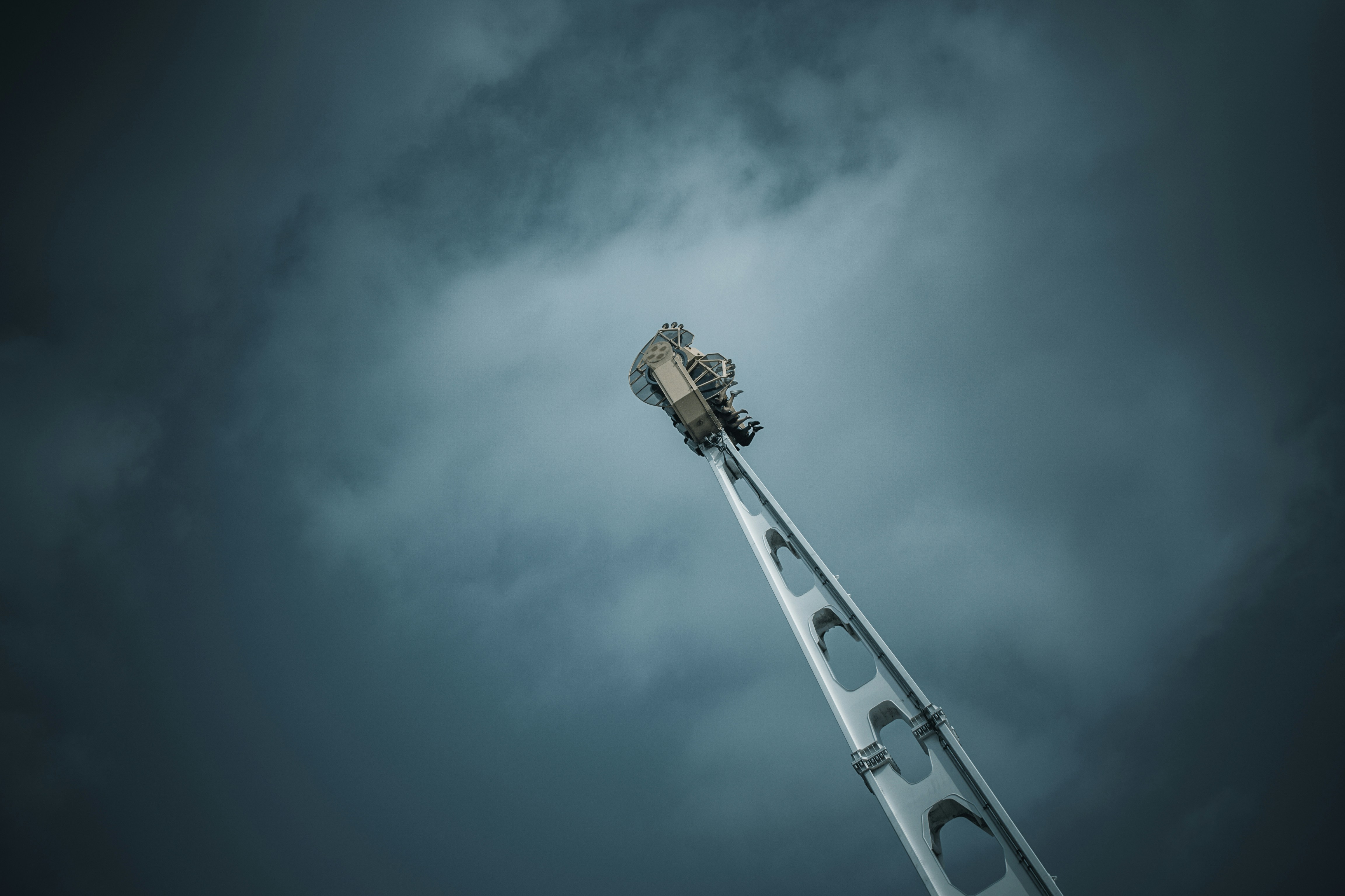 A tall metal pole under a cloudy sky