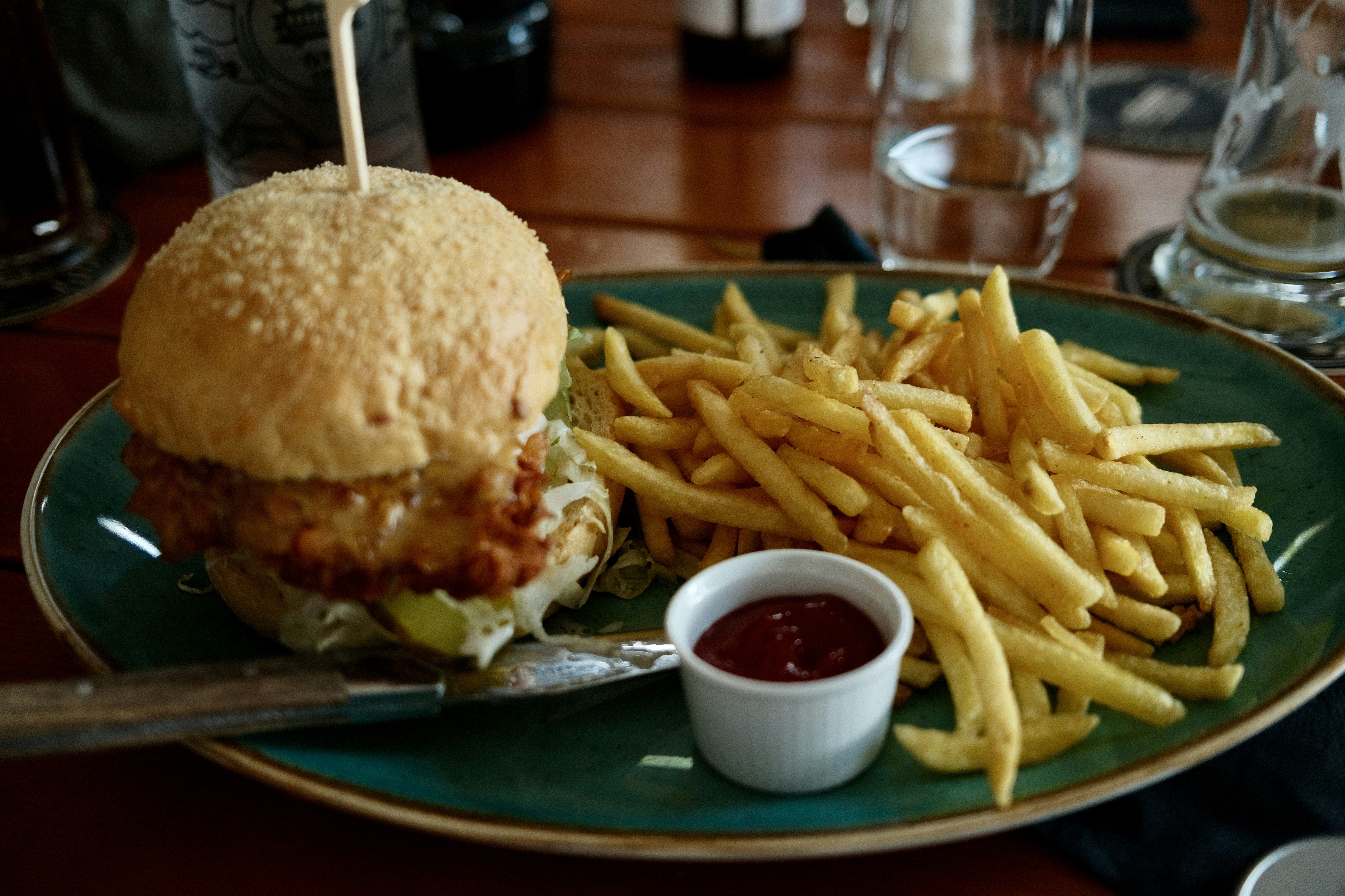 A plate with a sandwich and french fries on it, 