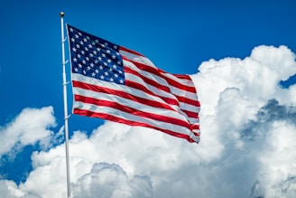 An american flag flying high in the sky