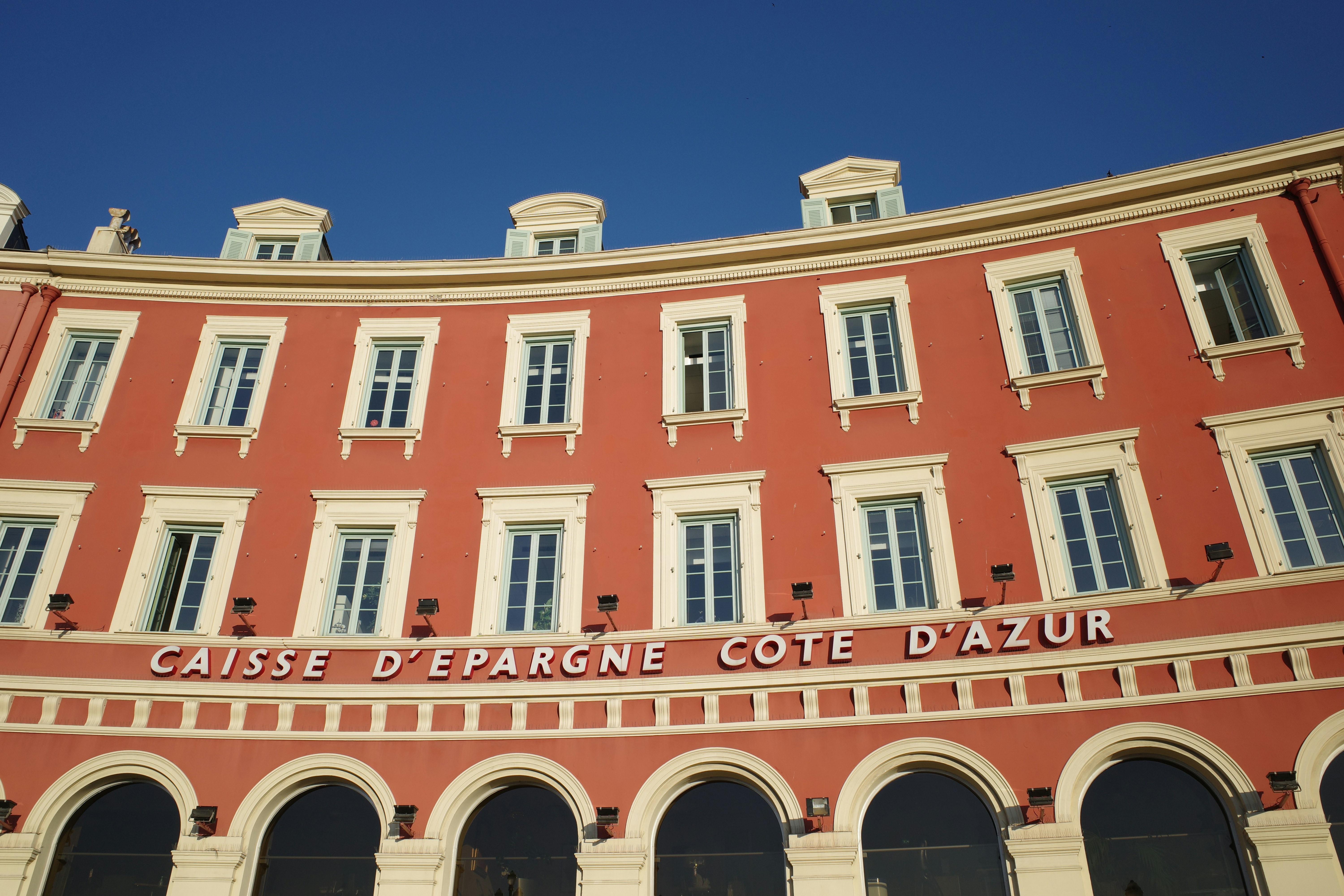 A large red building with white trim and windows