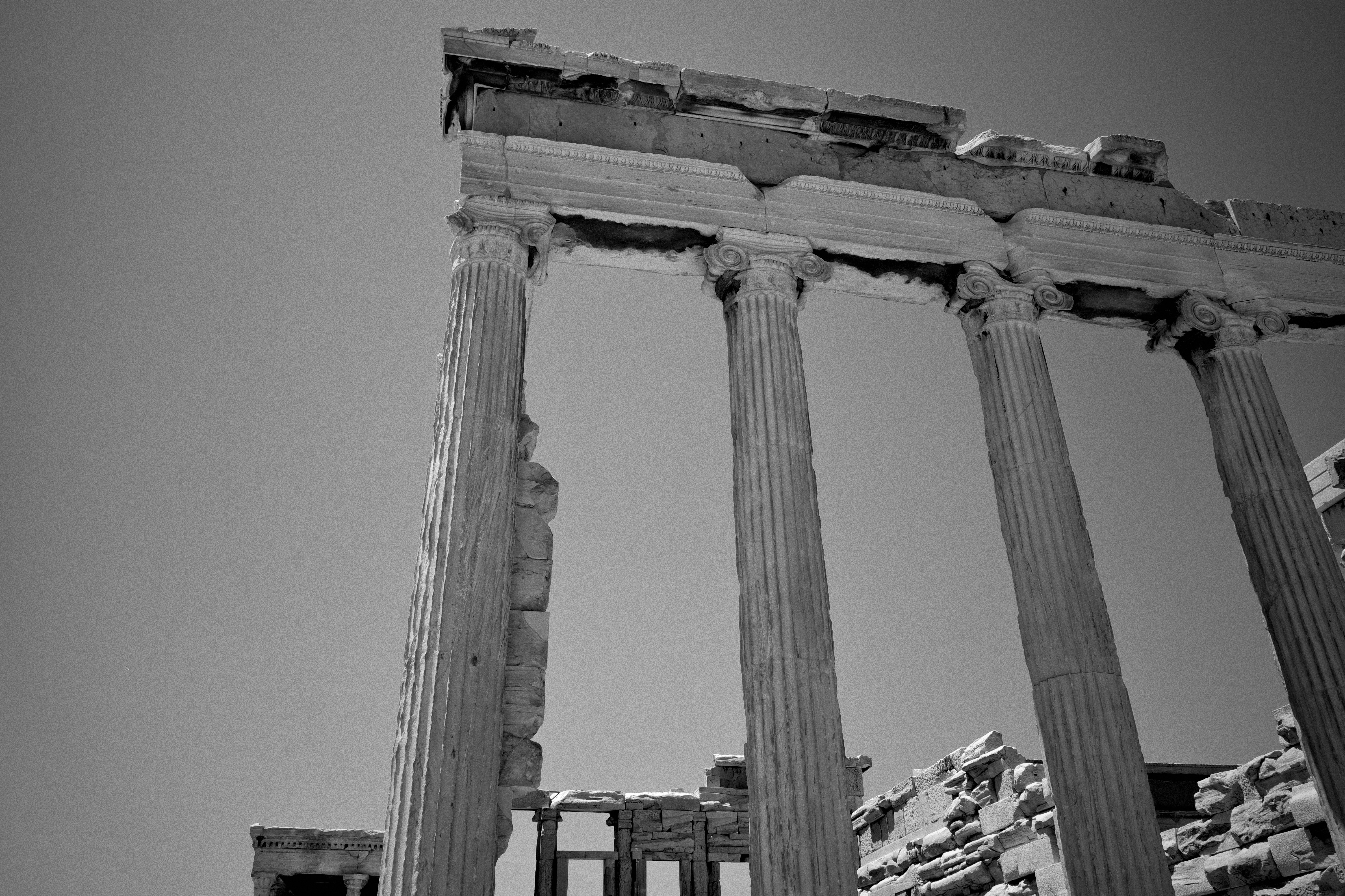 A black and white photo of the ruins of a roman temple