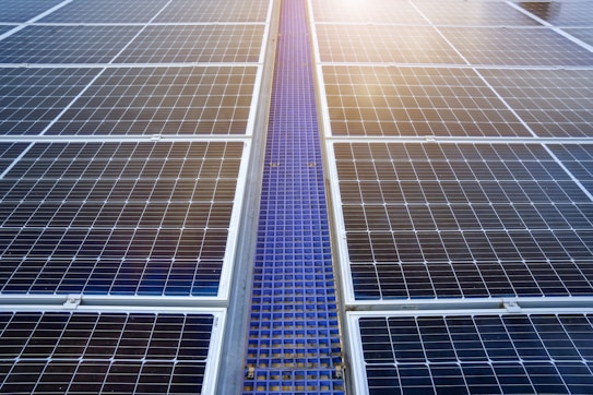 A solar panel with the sun shining through it