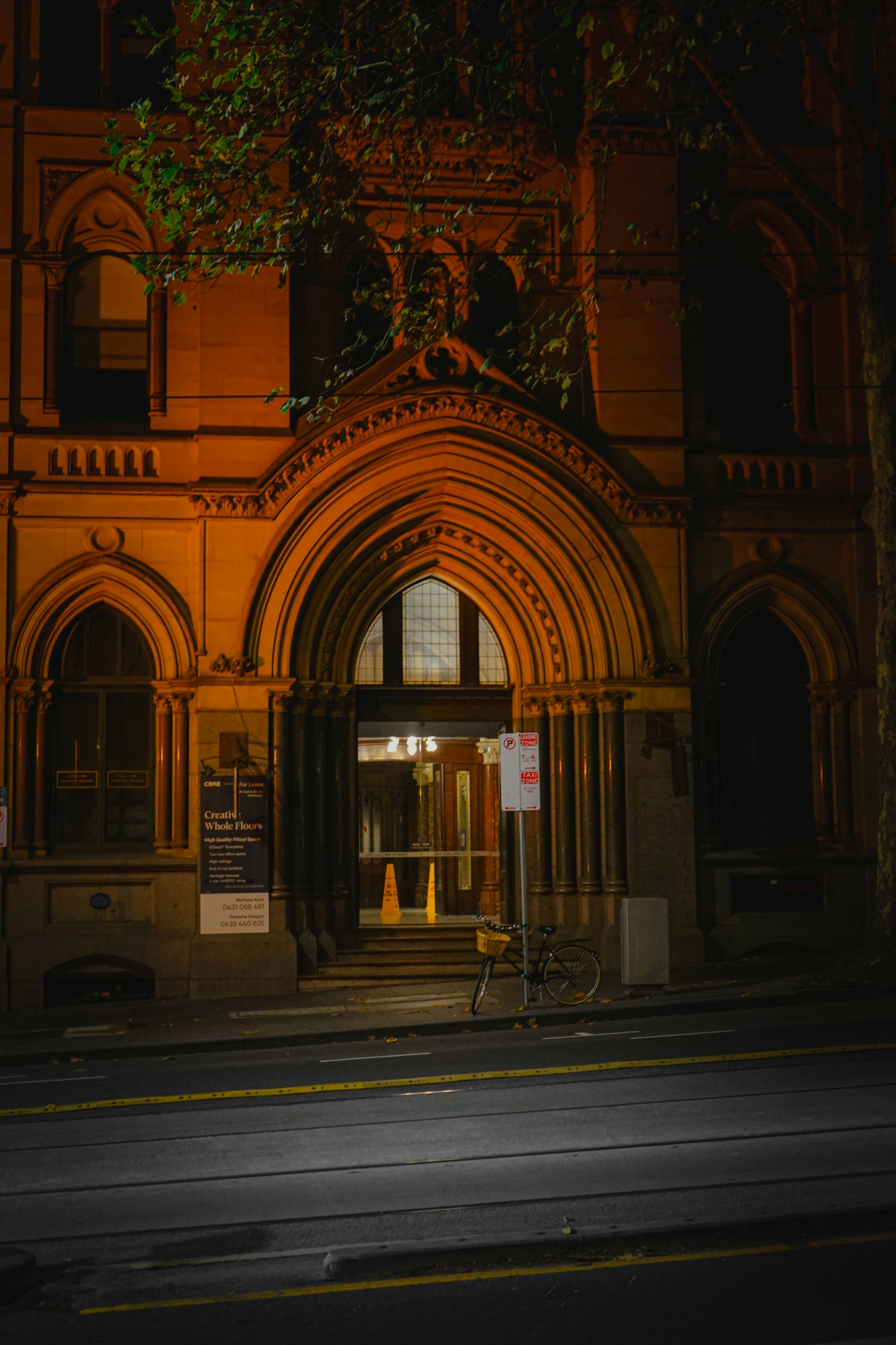 An old building with a tree in front of it