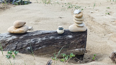 A pile of rocks sitting on top of a log